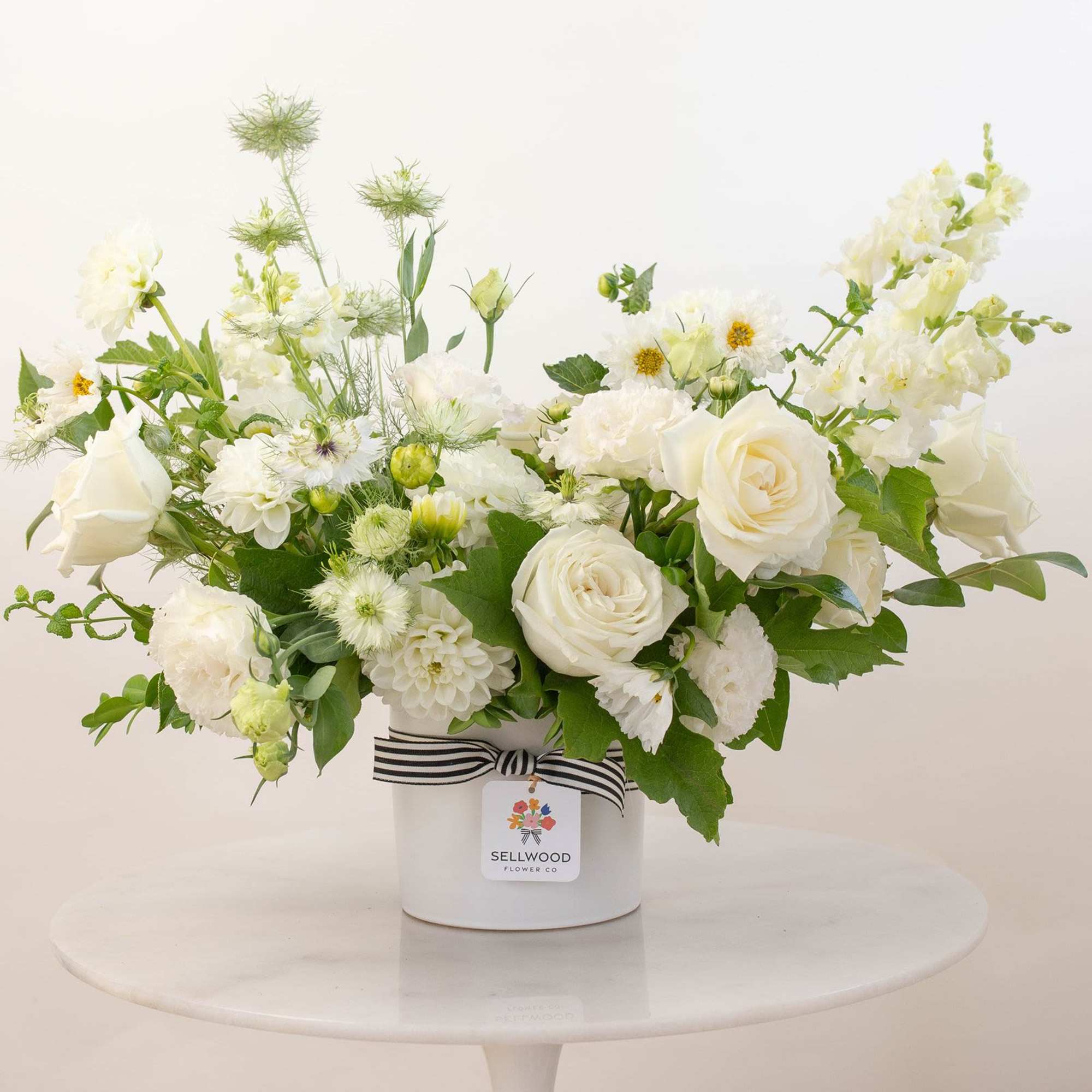 A stunning white bouquet that evokes simplicity, calmness, and peace. This arrangement