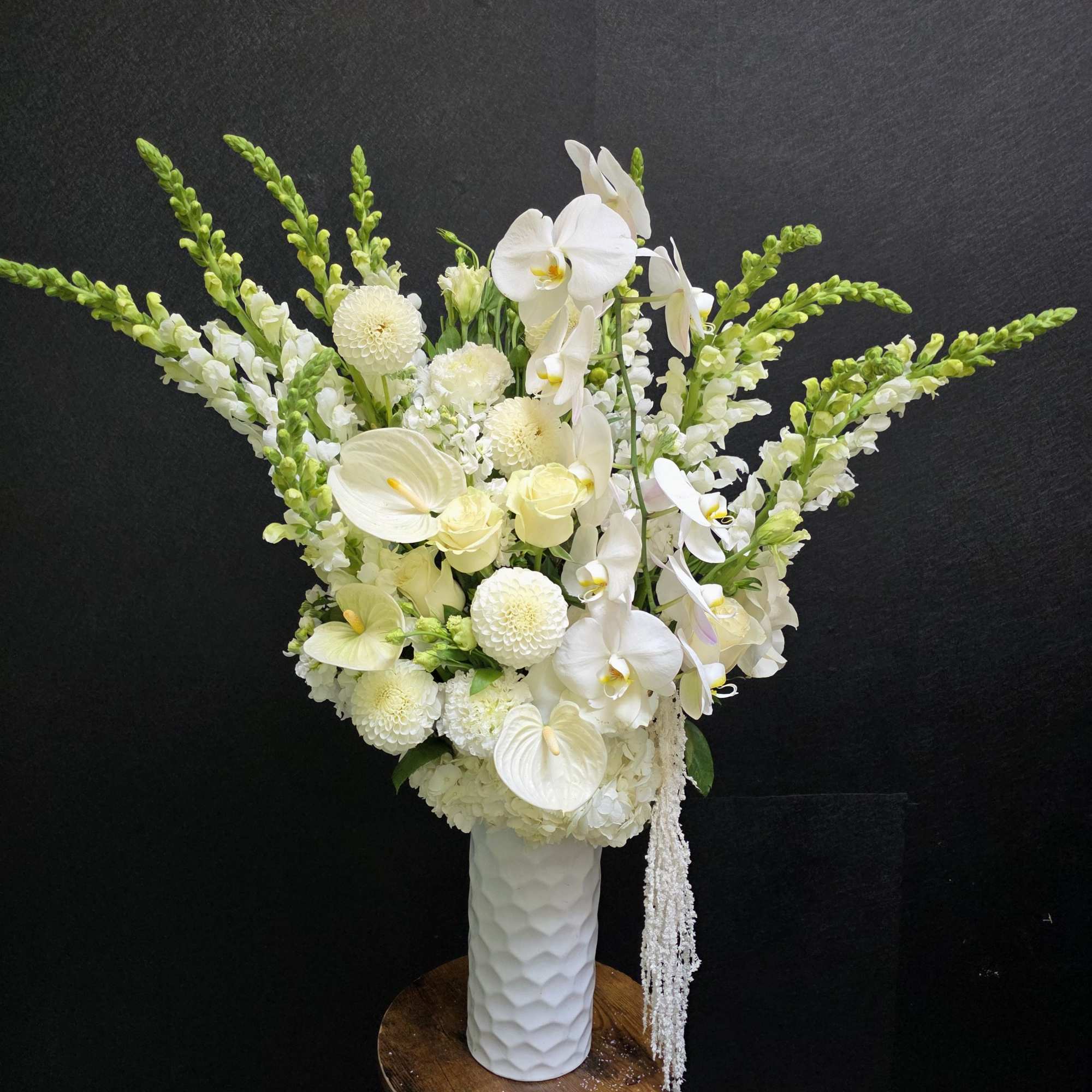 Tall, sculptural white blooms make a serene first impression in this flower