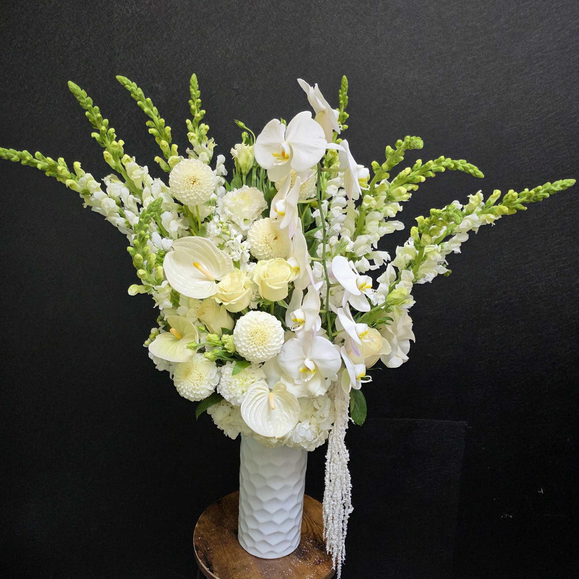 Tall, sculptural white blooms make a serene first impression in this flower