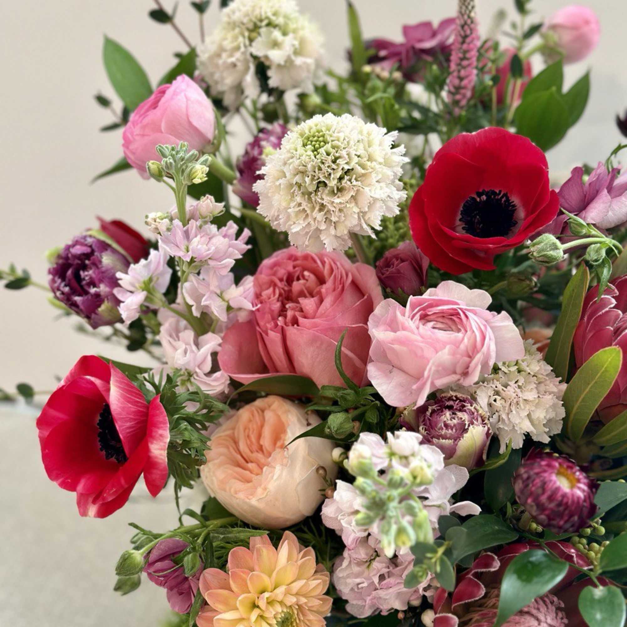 Mixed bouquet with pink, red, and white flowers