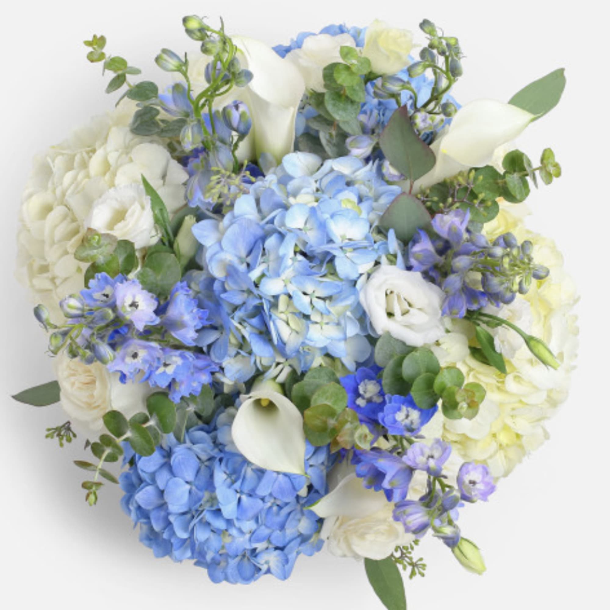 Bouquet of blue and white flowers with eucalyptus and calla lilies