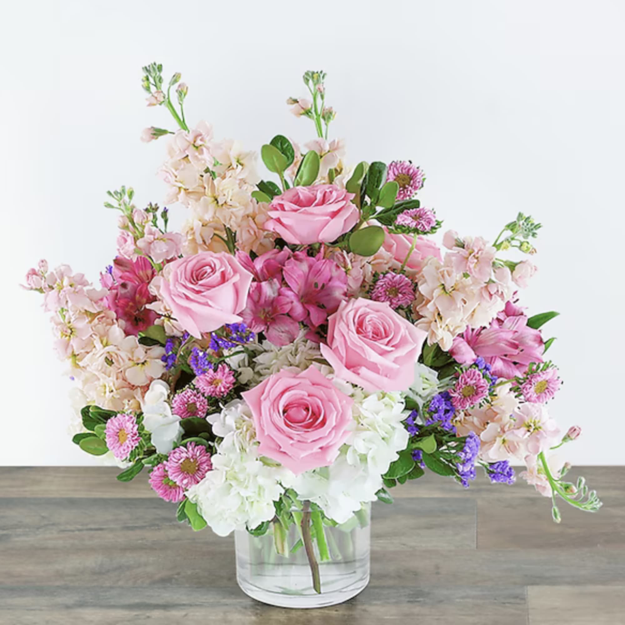 Beautiful flowers consisting of white hydrangea, pink roses, Matsumoto and more in