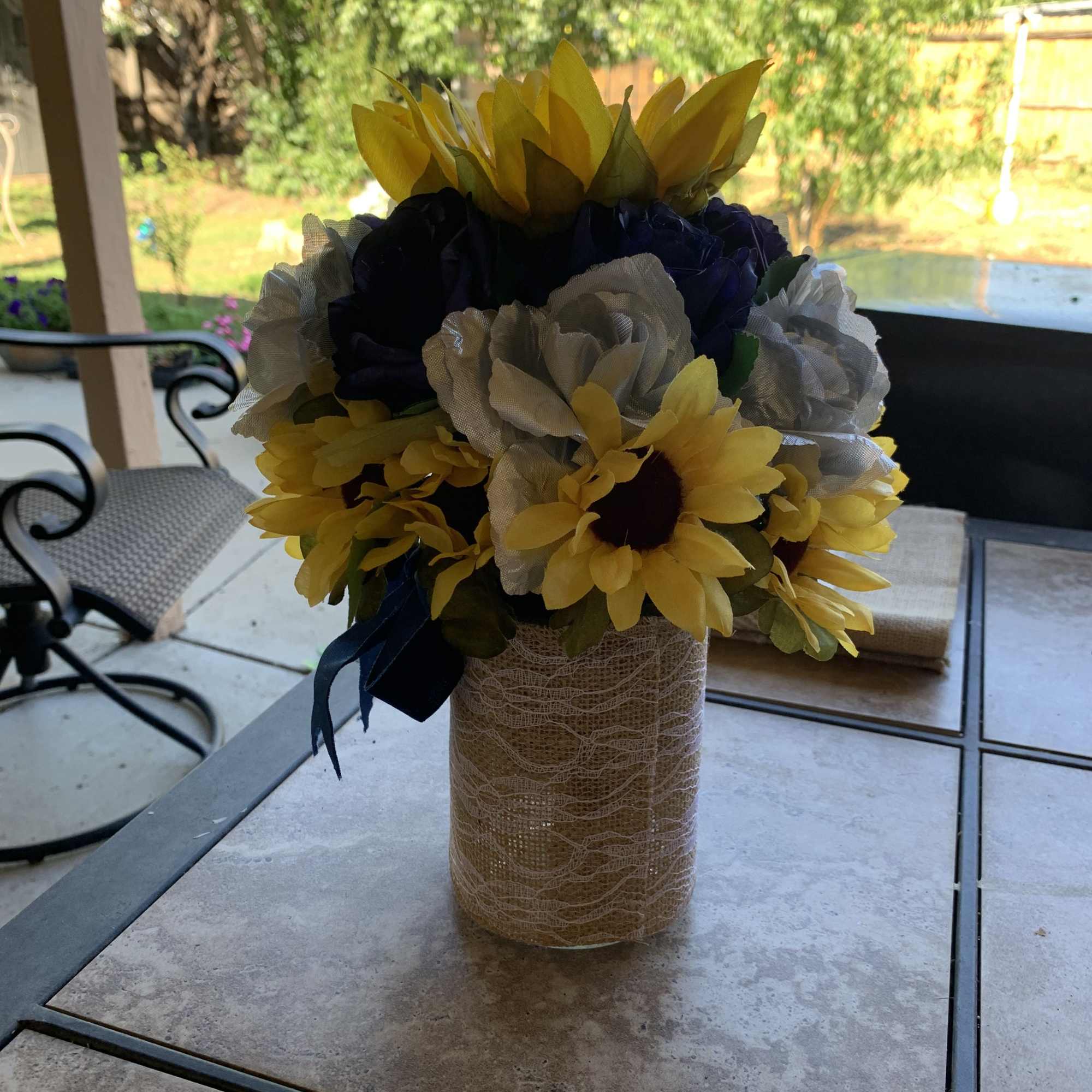 Bright yellow sunflowers steal the show in this cheerful sunflower arrangement for
