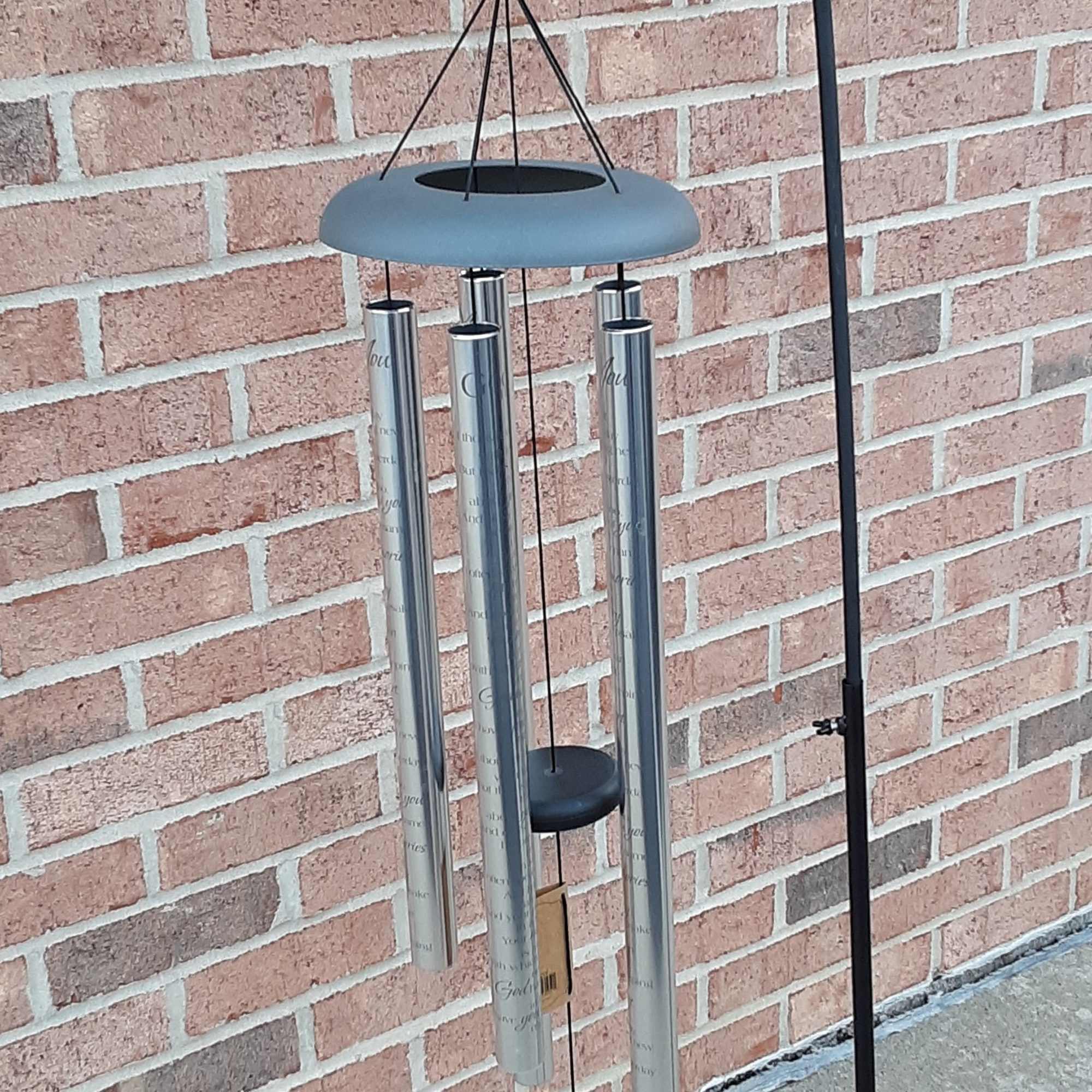 Blue ribbon wind chime with a small floral accent