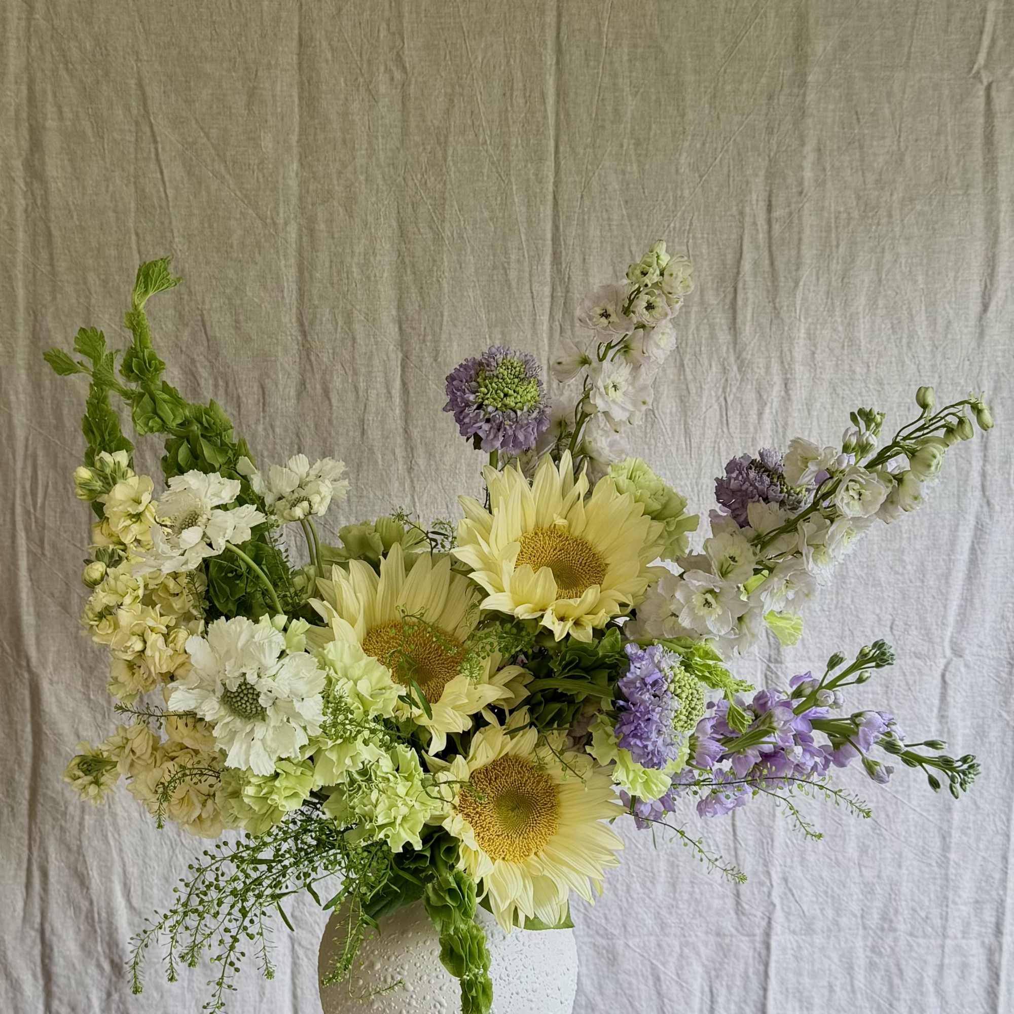 Sunflowers take center stage in this Sweet Summer flower arrangement, a cheerful