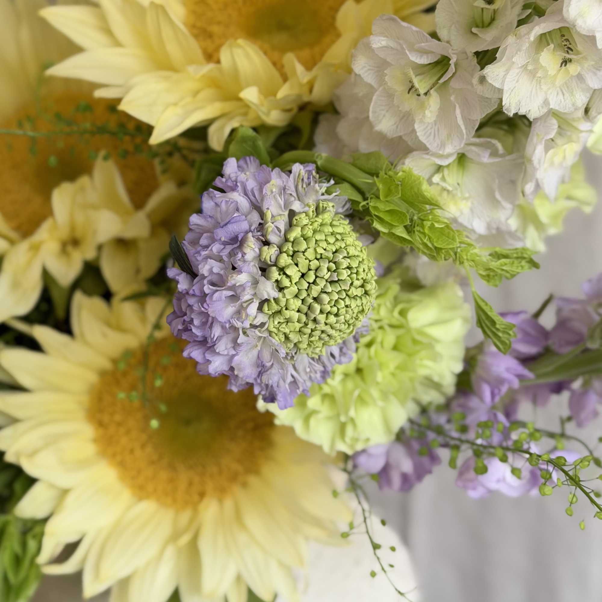 Sunflowers take center stage in this Sweet Summer flower arrangement, a cheerful