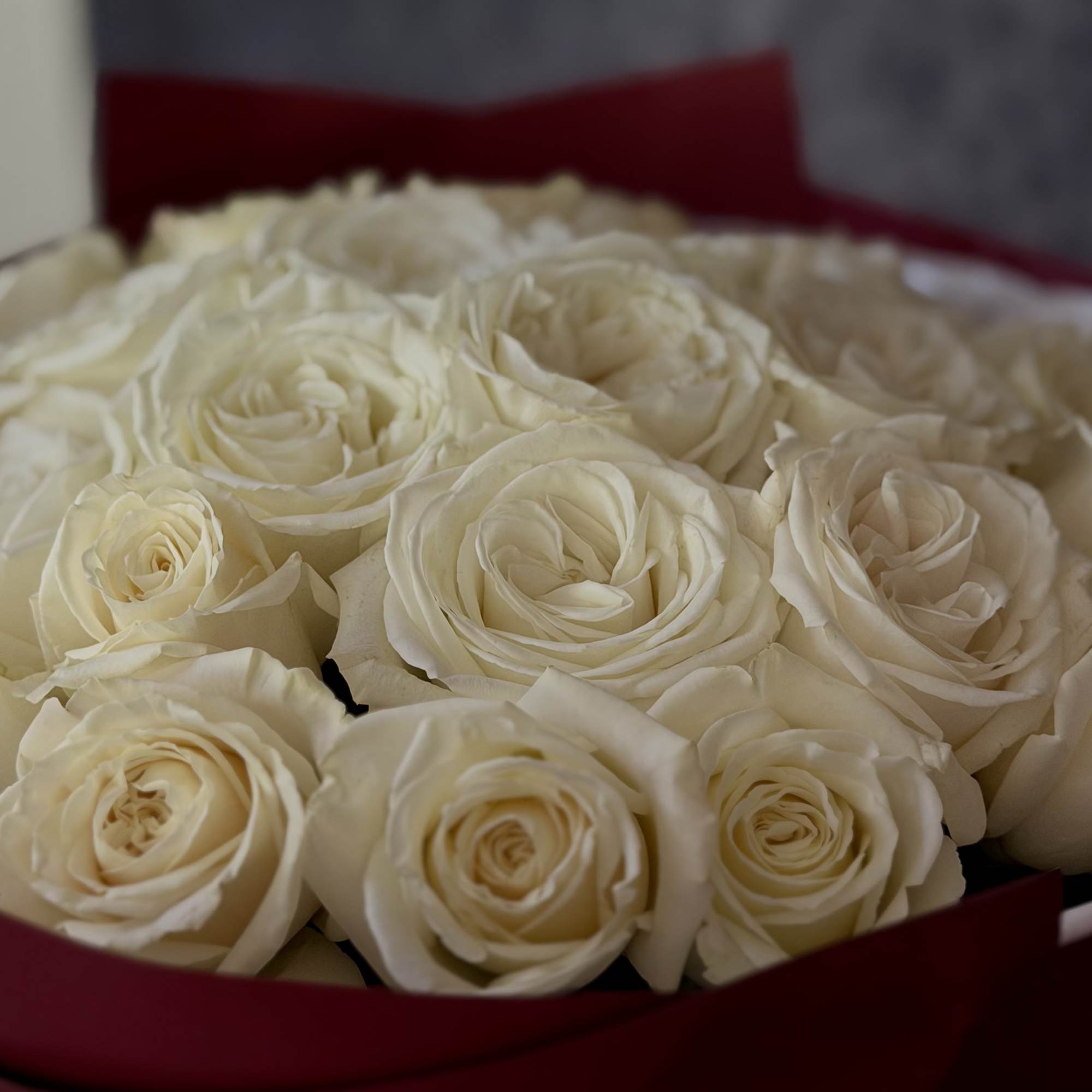 A lush cloud of cream-white roses makes an immediate, elegant impression-perfect as