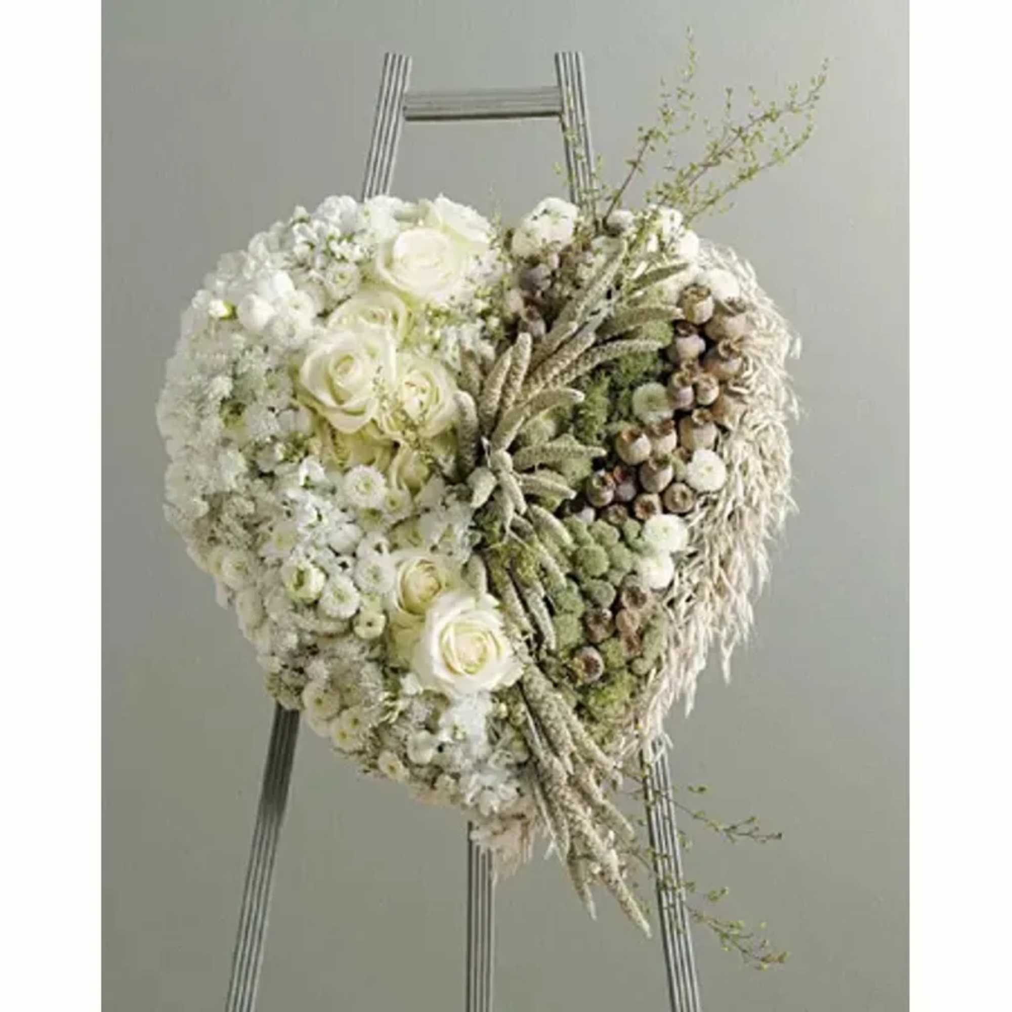 Wispy cluster adds to the unique design of this floral heart.
