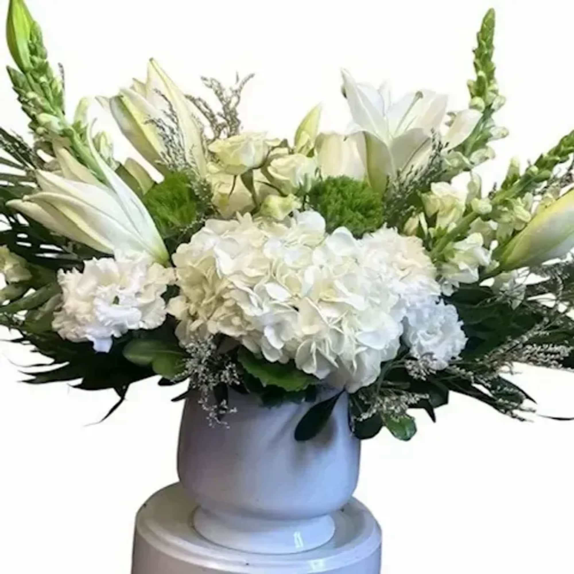 A serene spread of white hydrangeas forms the soft, cloud-like center of