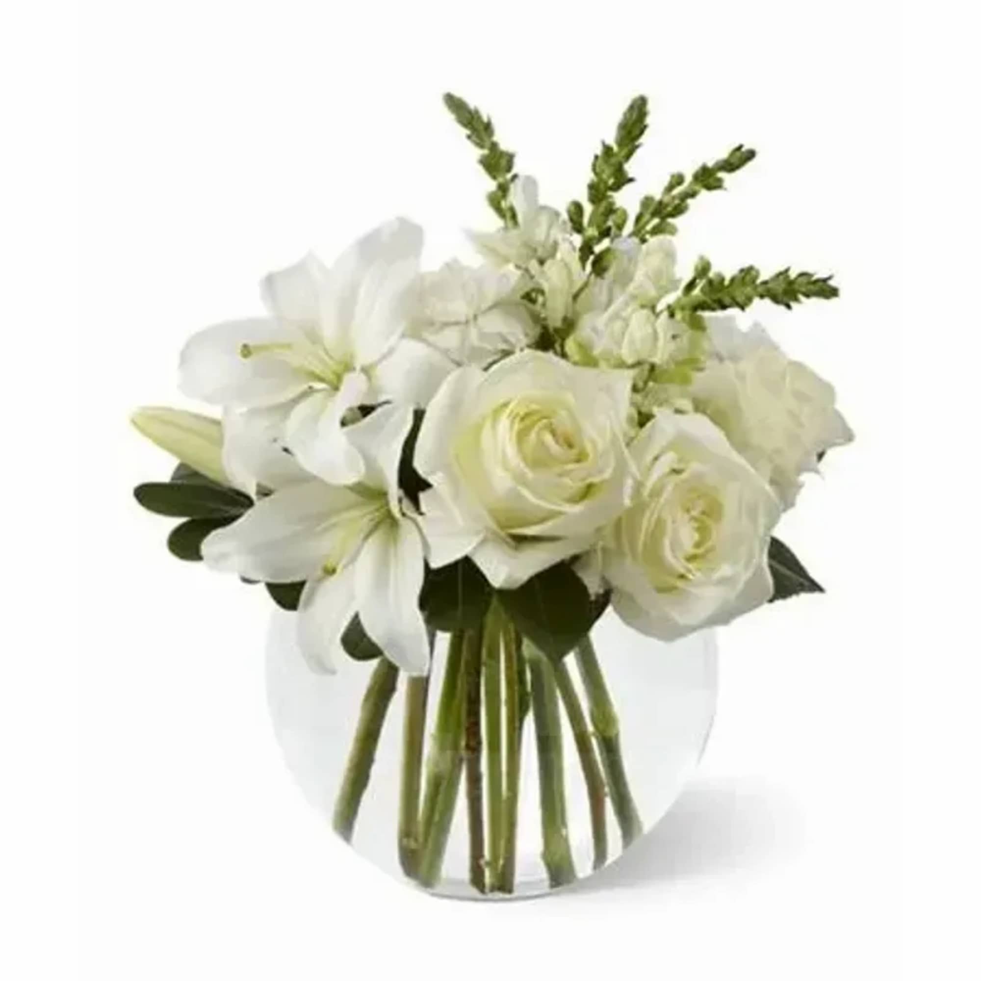 White roses, Asiatic lilies, snapdragons and carnations are offset by lush greens