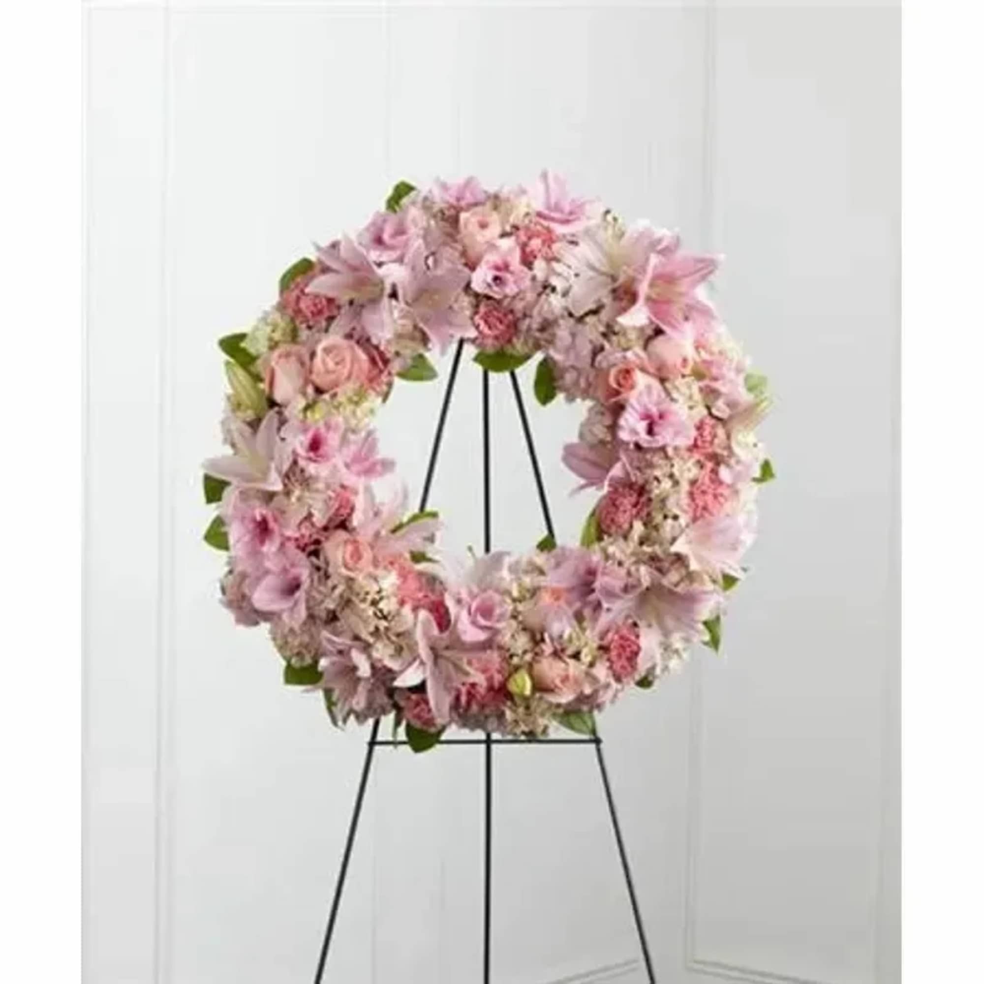 Pink roses, Oriental lilies, gladiolus, hydrangea and carnations are brought together with