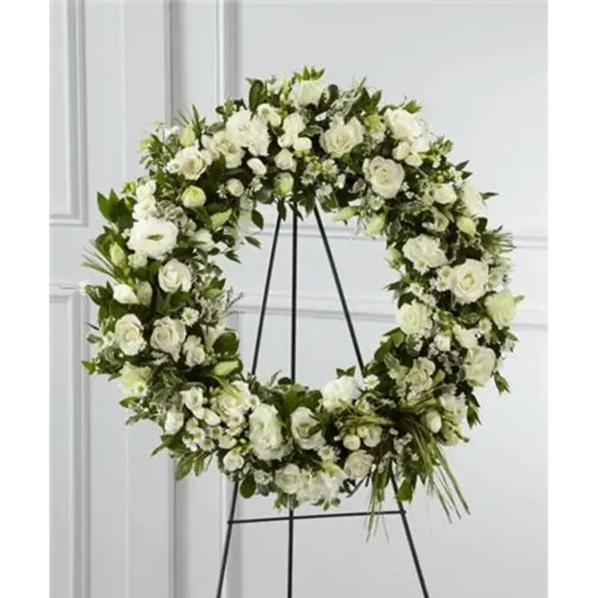 Elegant white freesia, double lisianthus, spray roses, monte casino asters and limonium