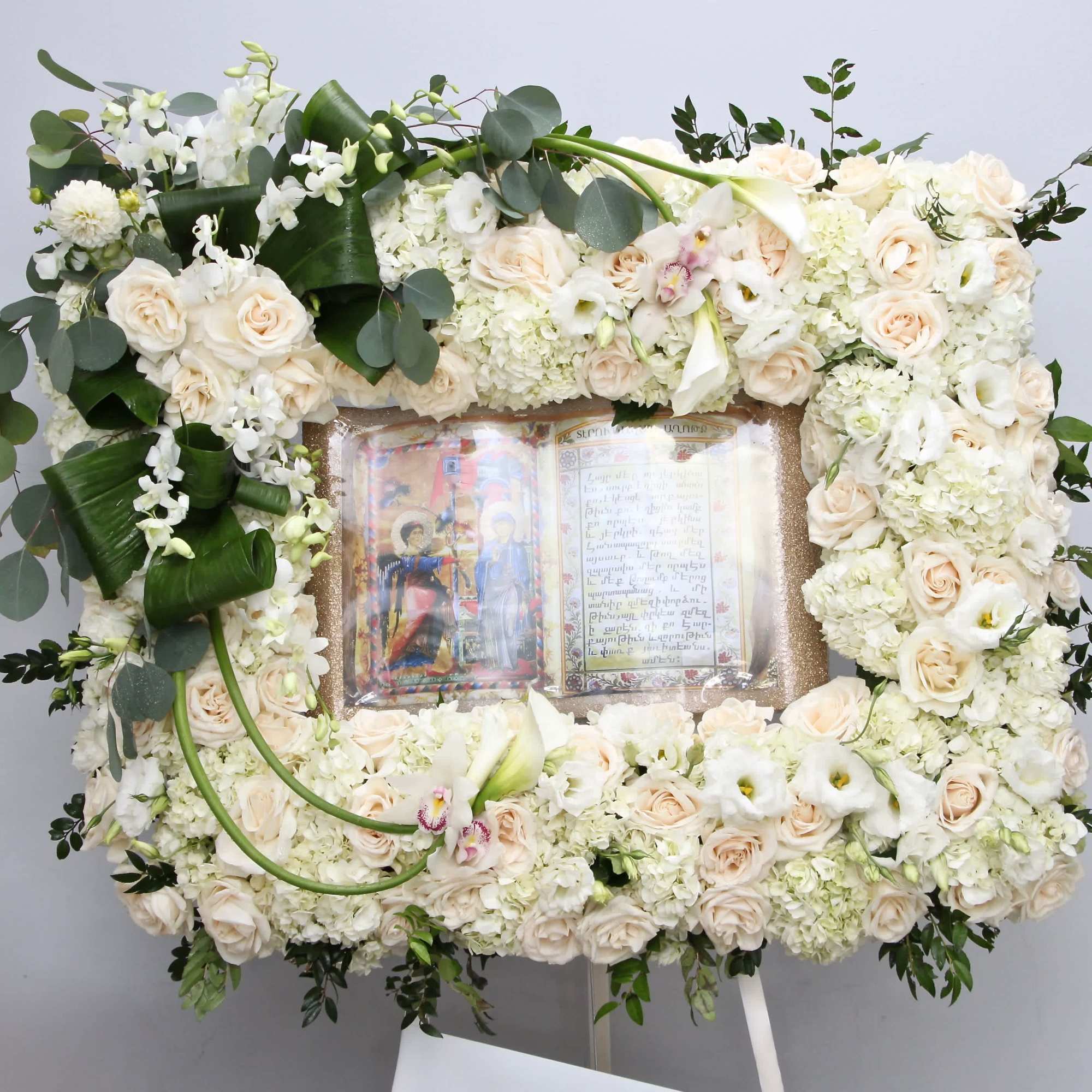 This frame arrangement includes roses, hydrangeas and seasonal florals.

Standard size is approximately
