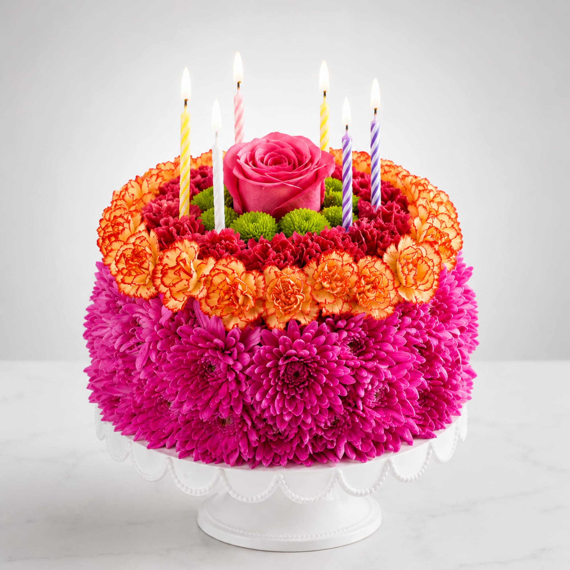 Birthday Celebration Cake is a stunning floral cake handcrafted with vibrant pink