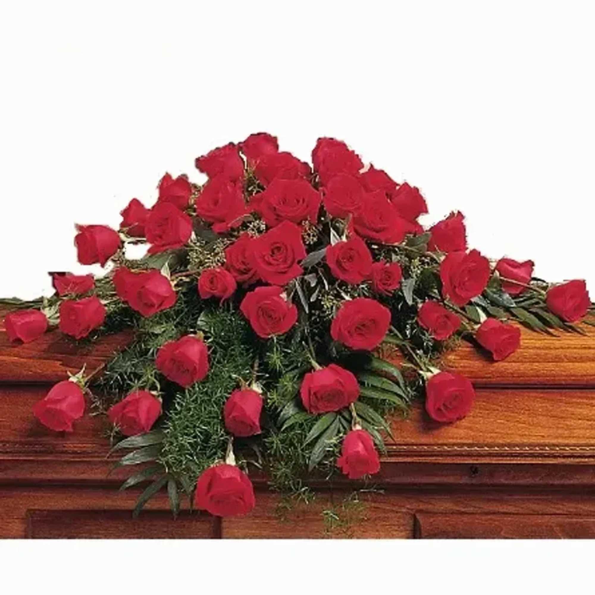 A long, low spray of deep red roses that lays gracefully across
