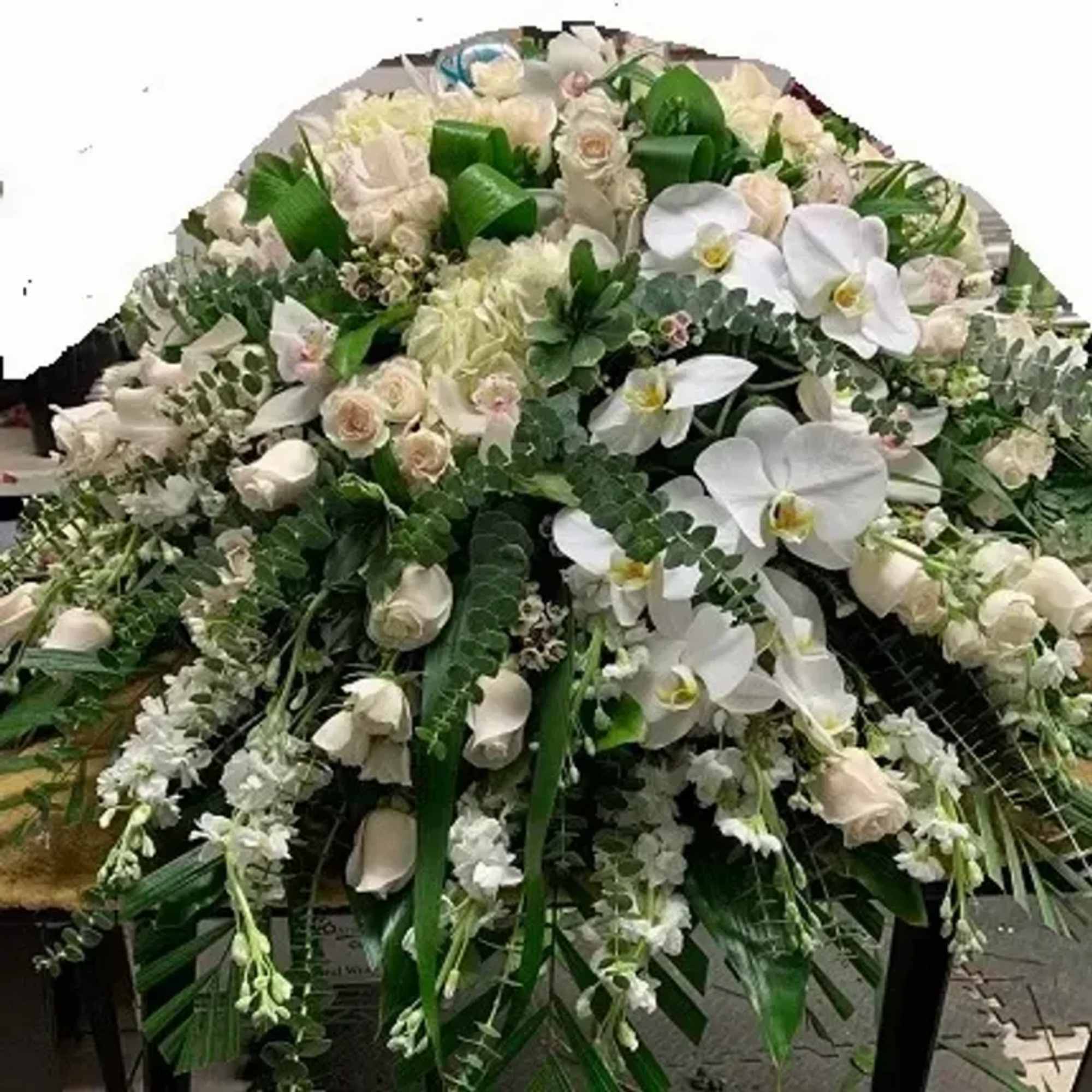 A cascading spray of pure white roses, phalaenopsis orchids and calla lilies