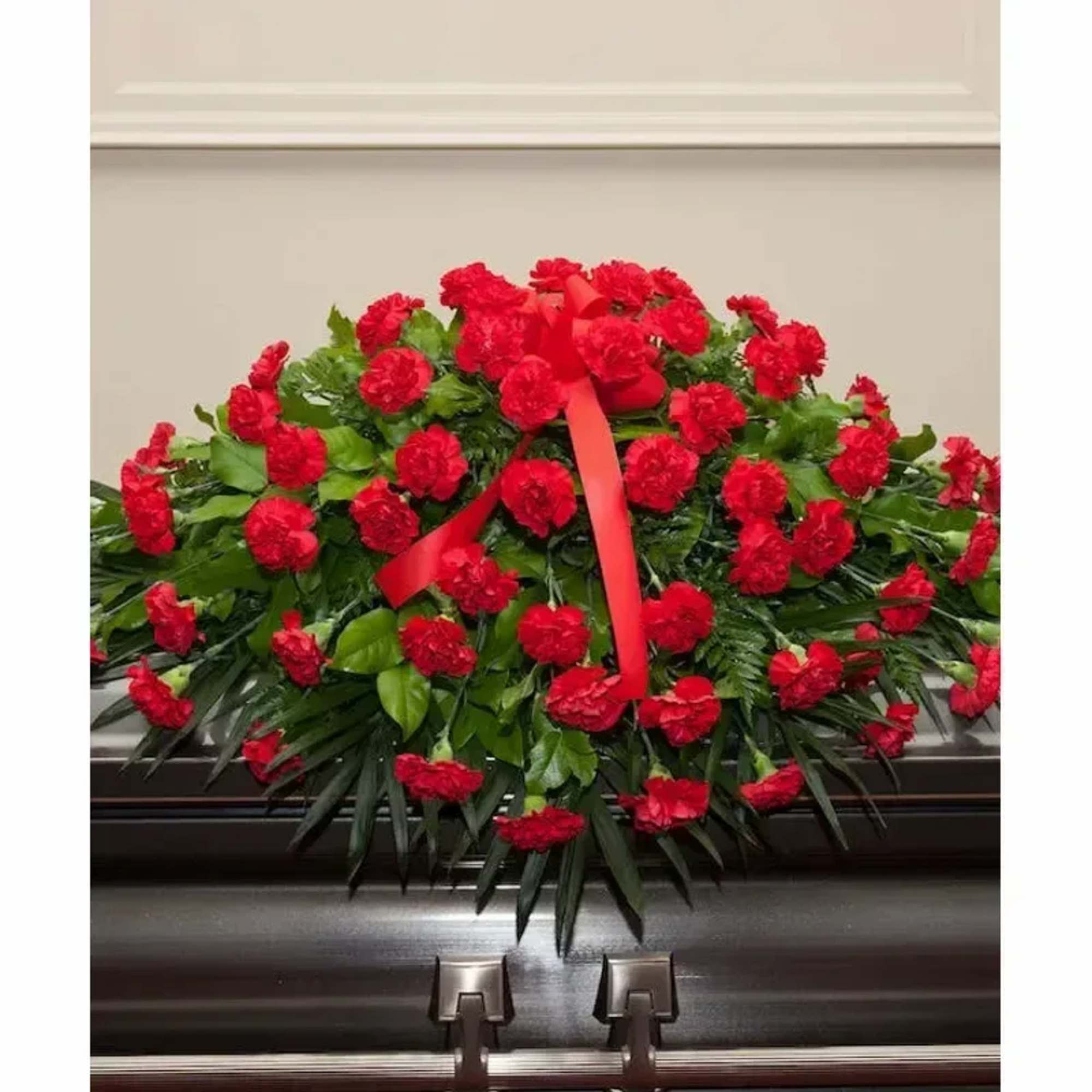 Red Carnations On A Casket Spray.
