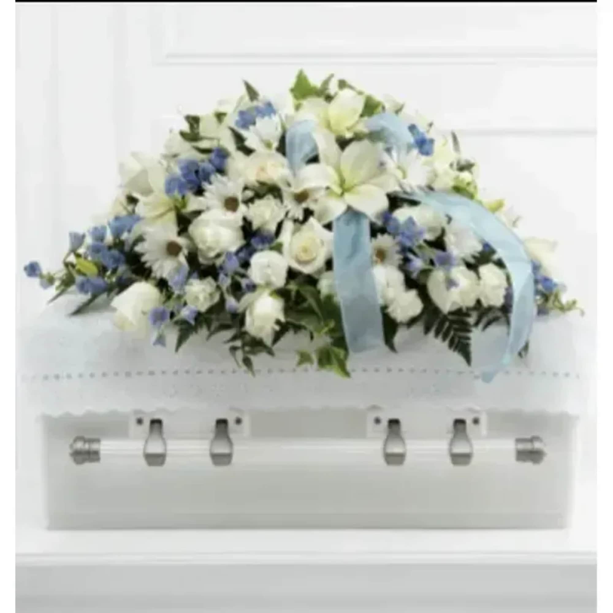 Soft white roses and pale blue delphinium create a calm, dignified statement