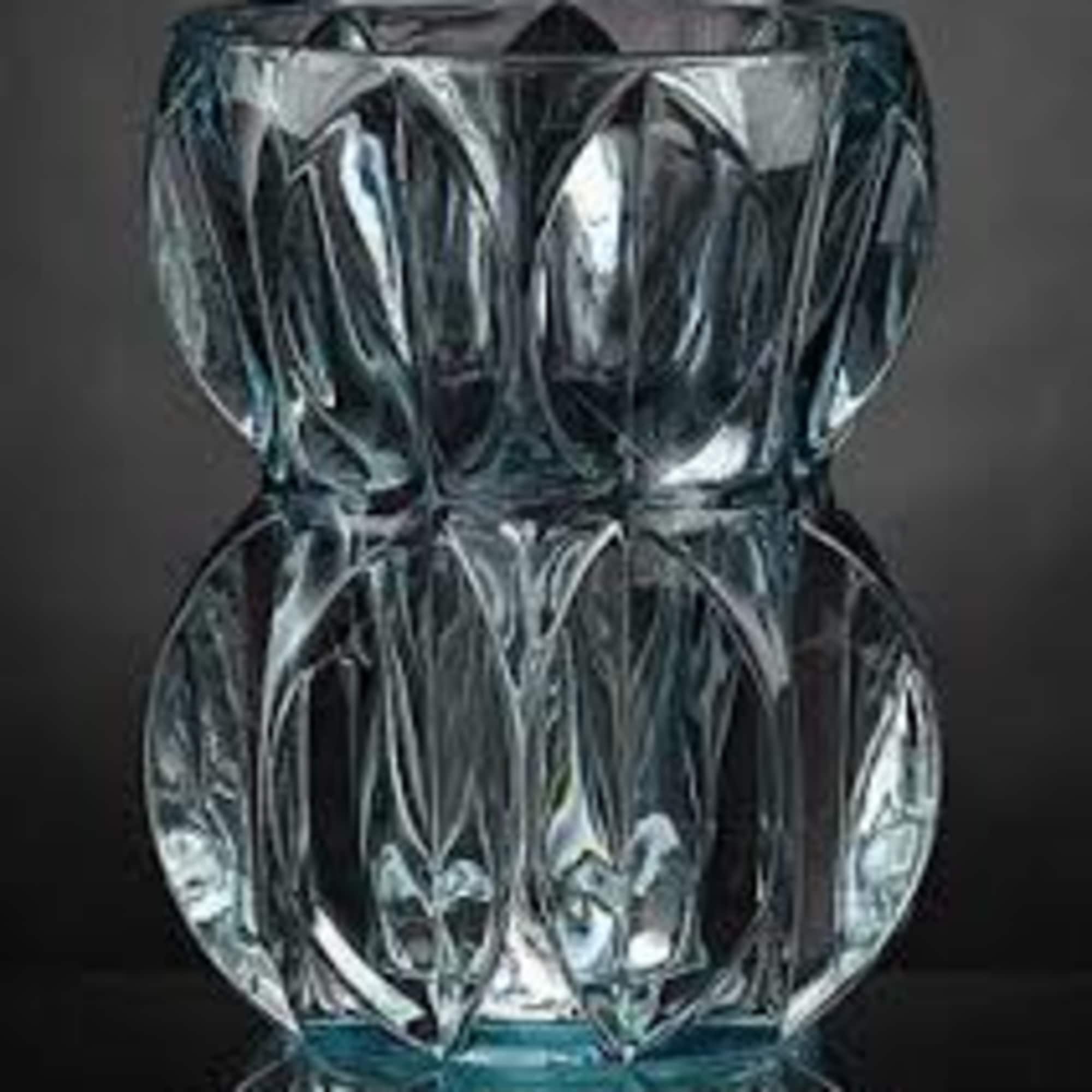 Clear faceted glass vase on a dark background
