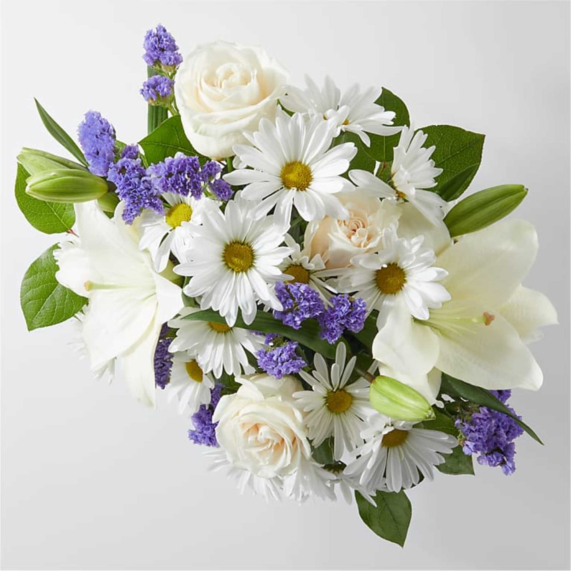 Bouquet of white daisies, roses, lilies, and purple filler flowers