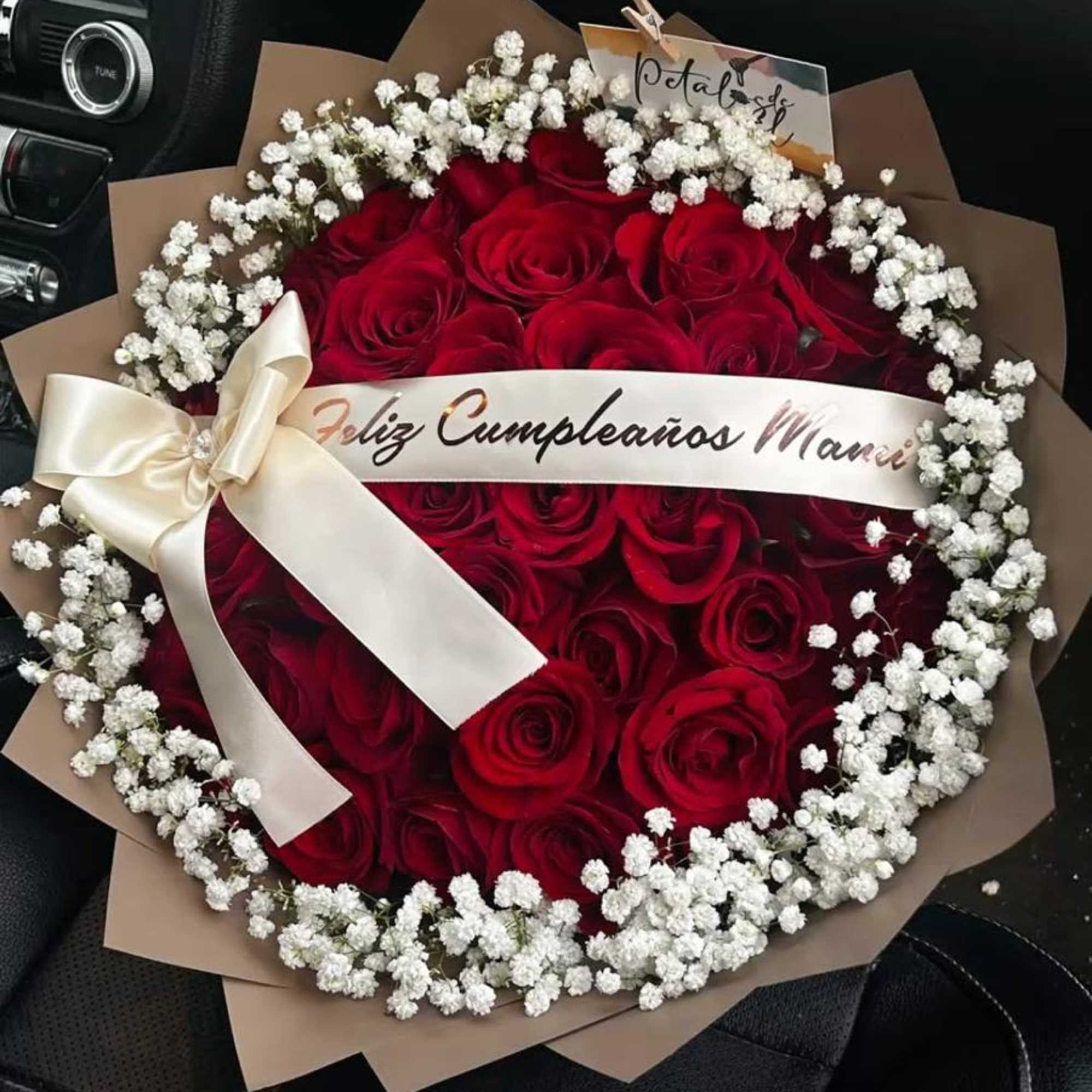 A lush dome of roses dressed for celebration-this flower arrangement is a