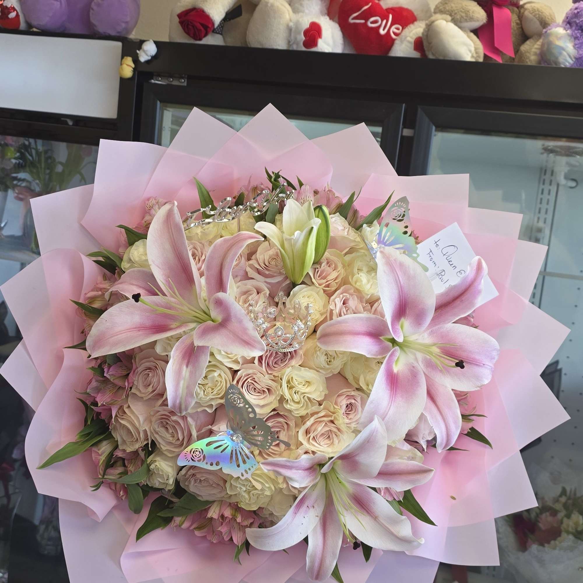 Soft pink lilies rising above a cloud of pale pink and cream