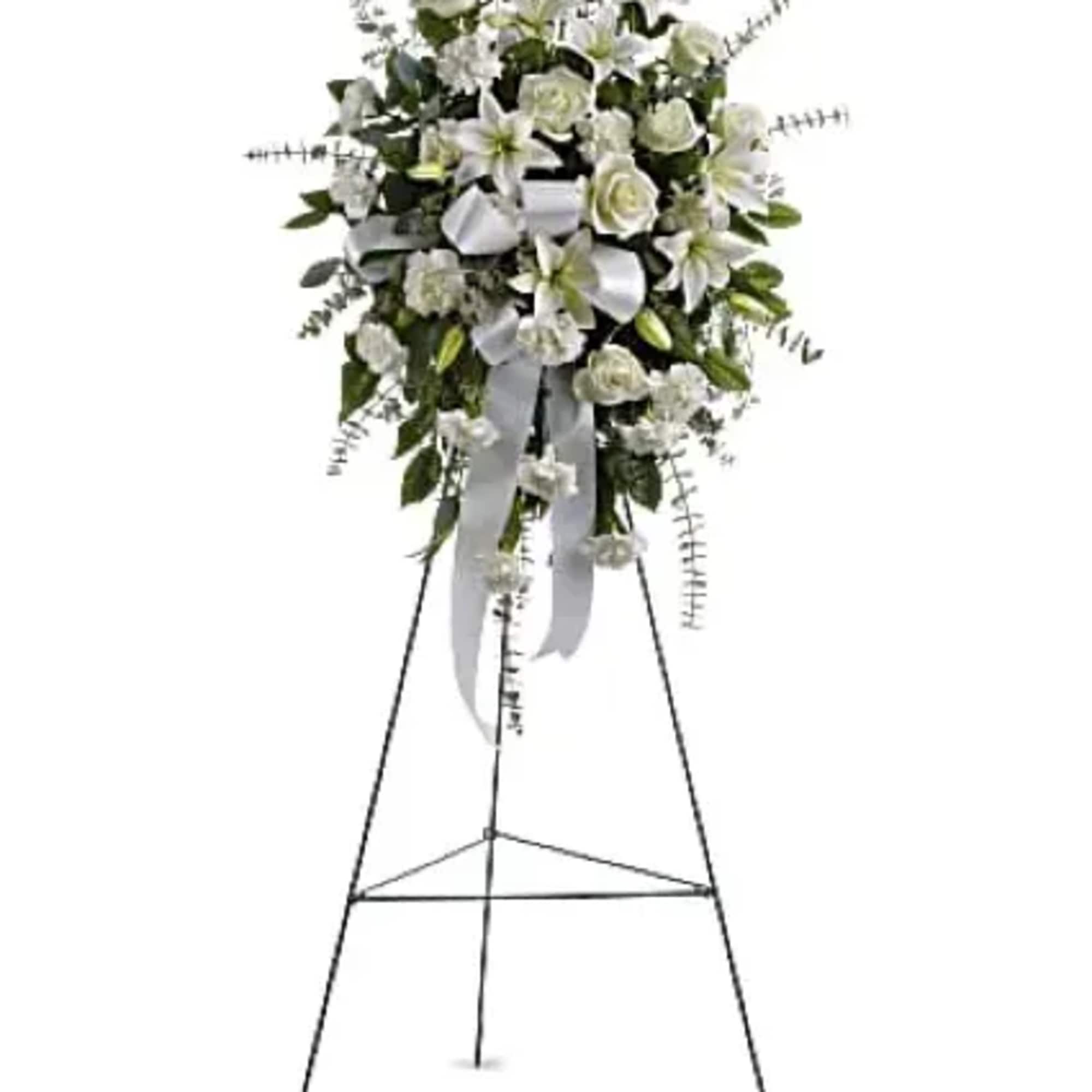 The lovely spray includes white roses, white Asiatic lilies and white carnations