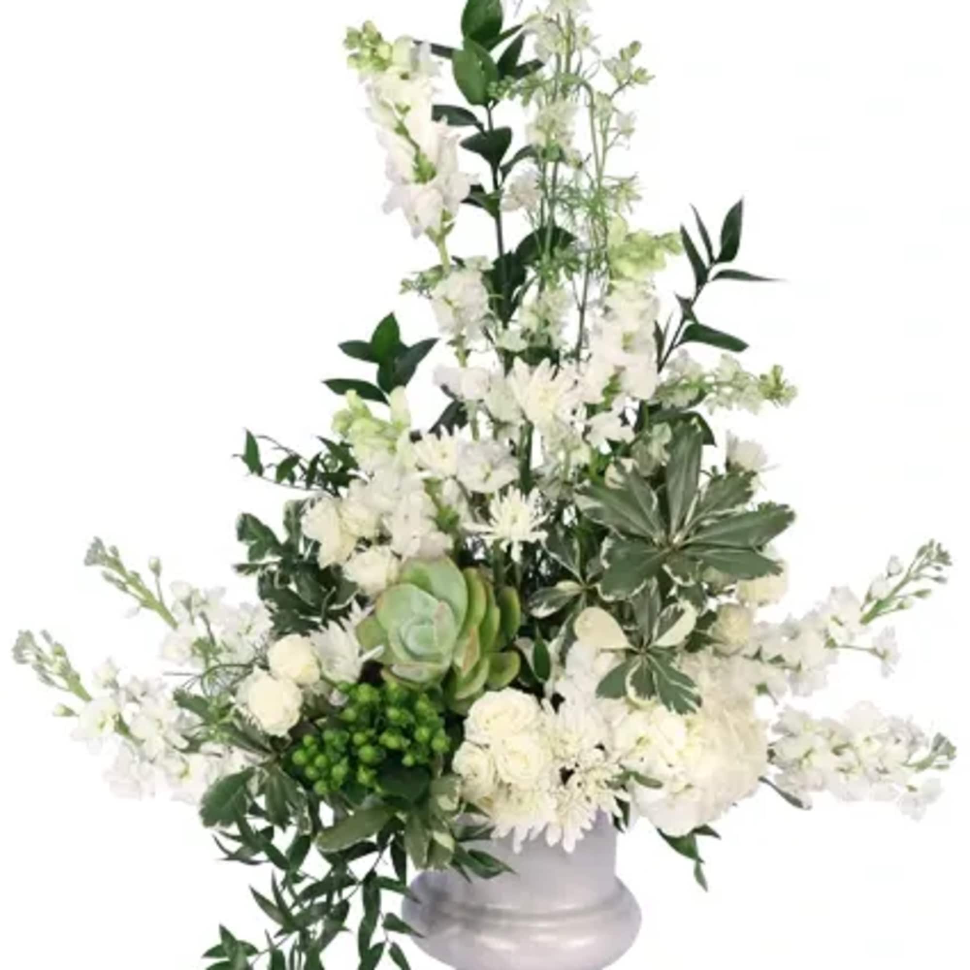 Elegant and pristine, this sympathy arrangement embodies the life of a lost