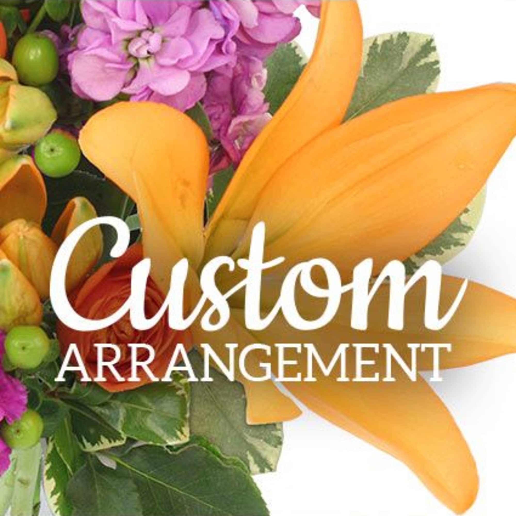 Bright orange calla lilies take center stage in this designer's choice flower