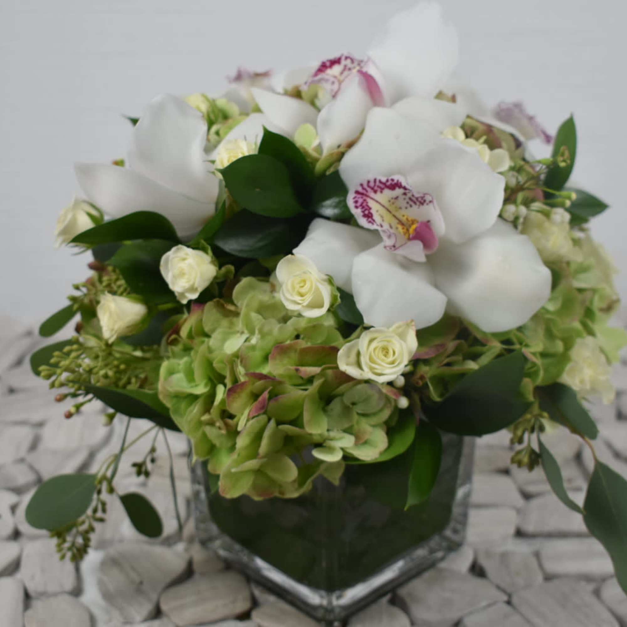 This cute little arrangement is perfect for a desk 
it comes in