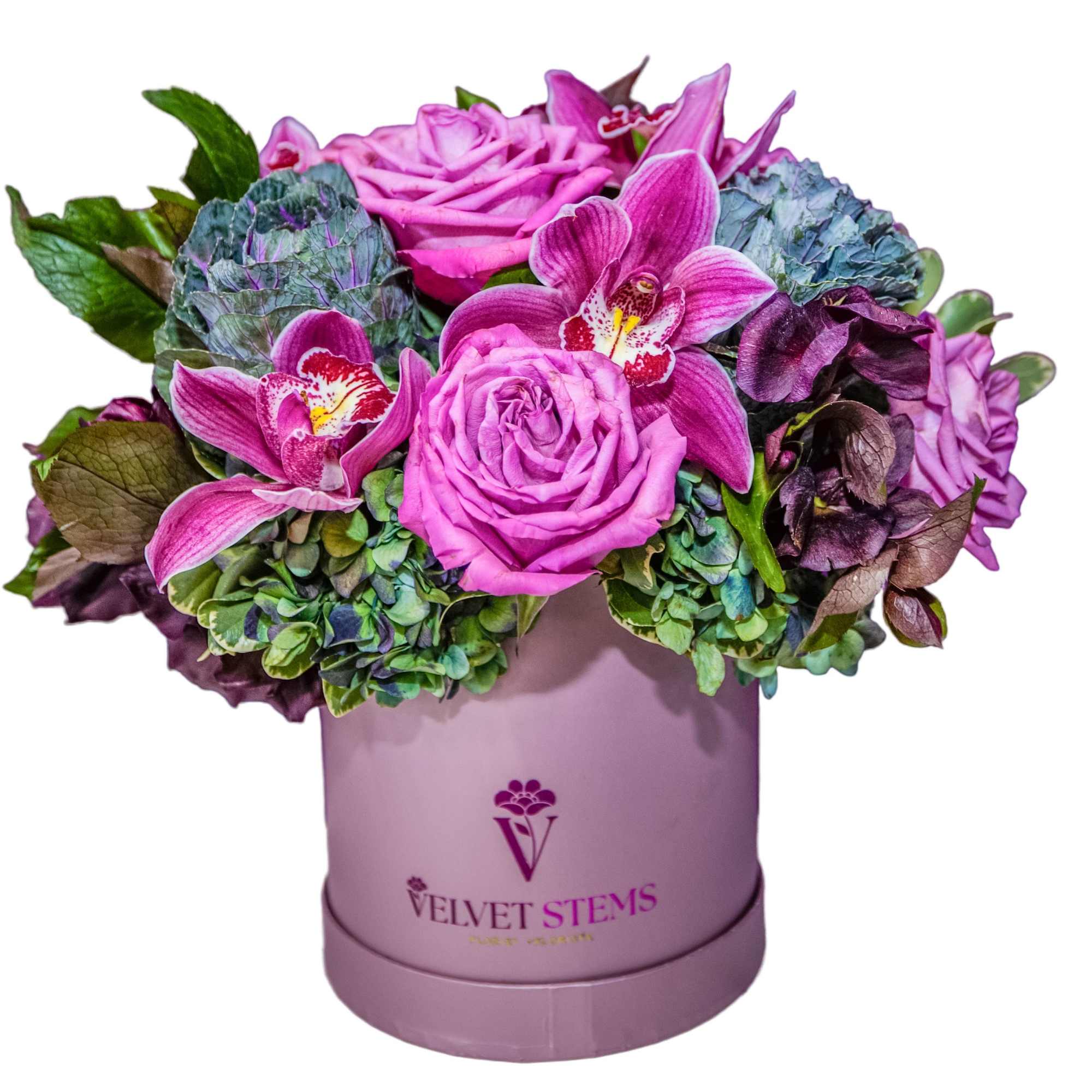 Pink roses and orchids arranged in a lavender hat box