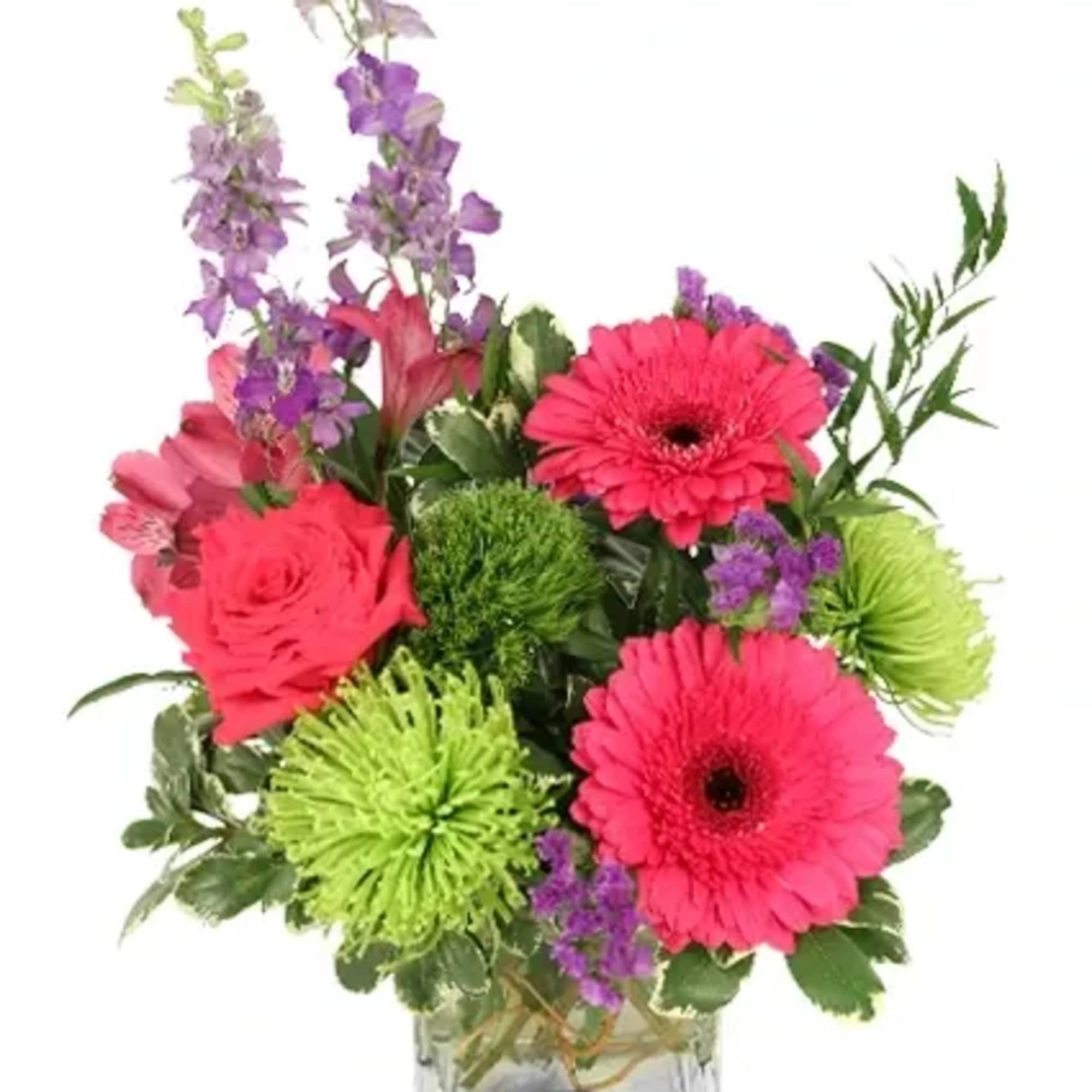 Celebrate their special day with a vibrant arrangement featuring pink gerberas, green
