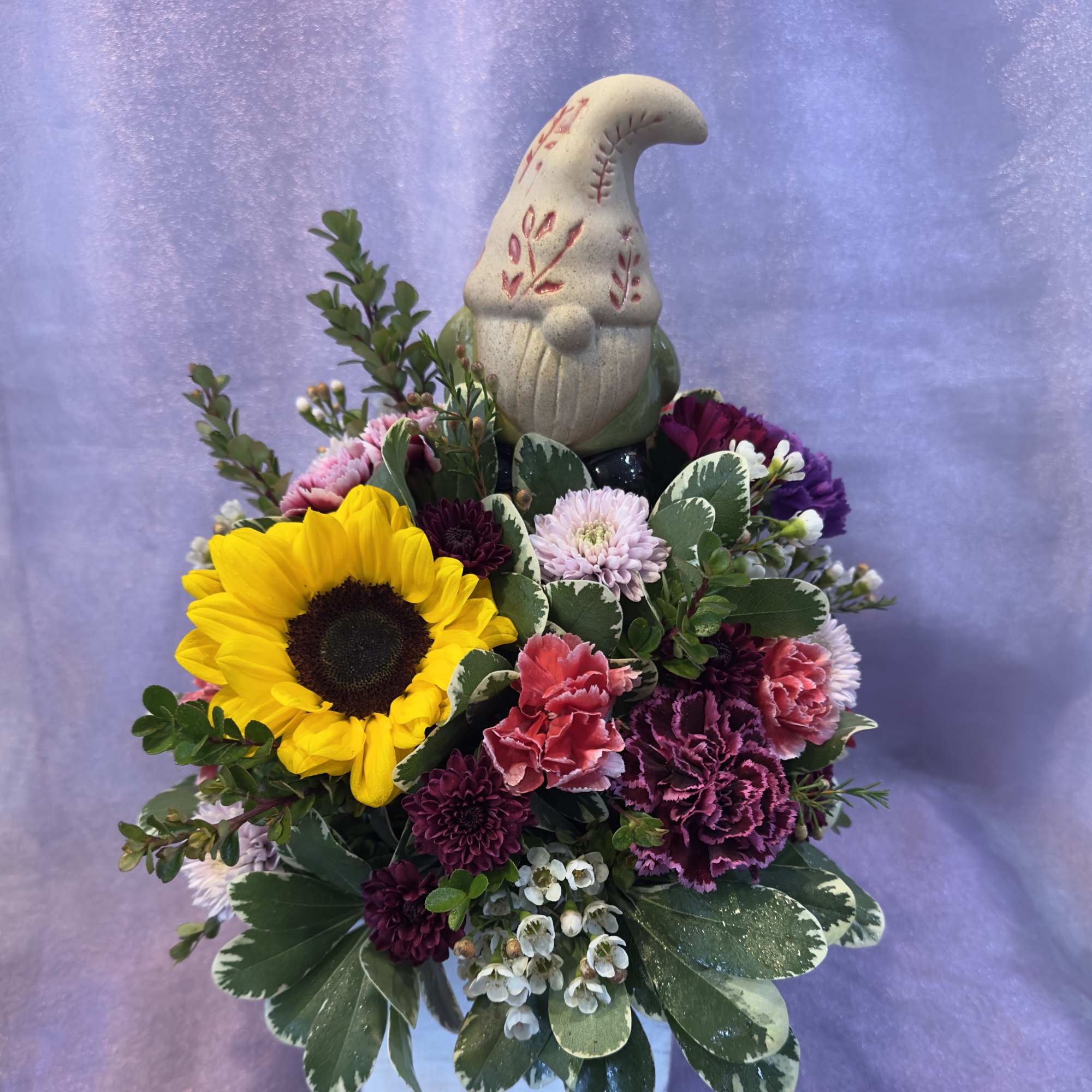 Get this arrangement for a gnome lover! Comes with a decorative bobblehead