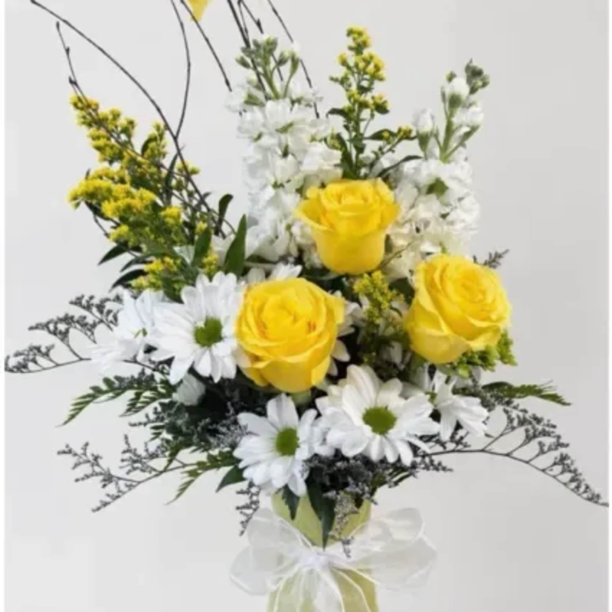 This arrangement feels like a little burst of sunshine. The bright yellow