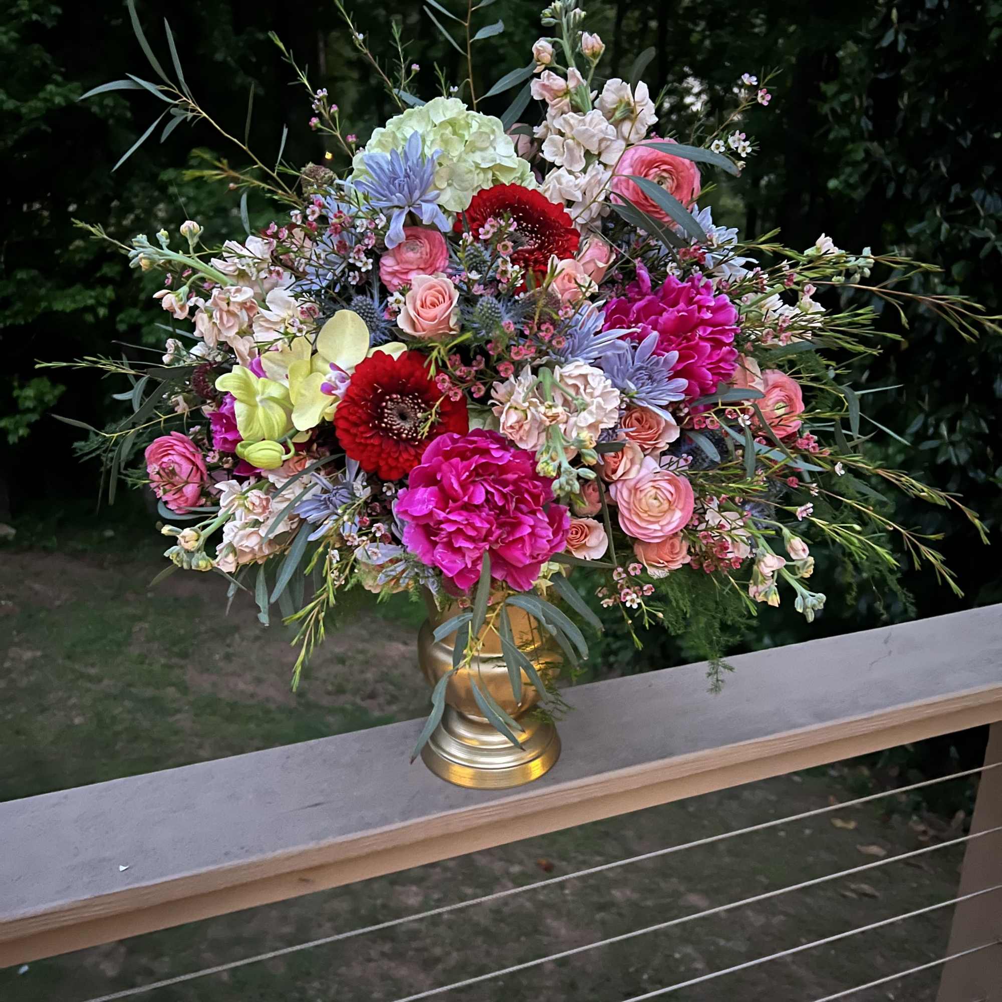 Assortment of high end flowers with orchid accents. Color palette options are