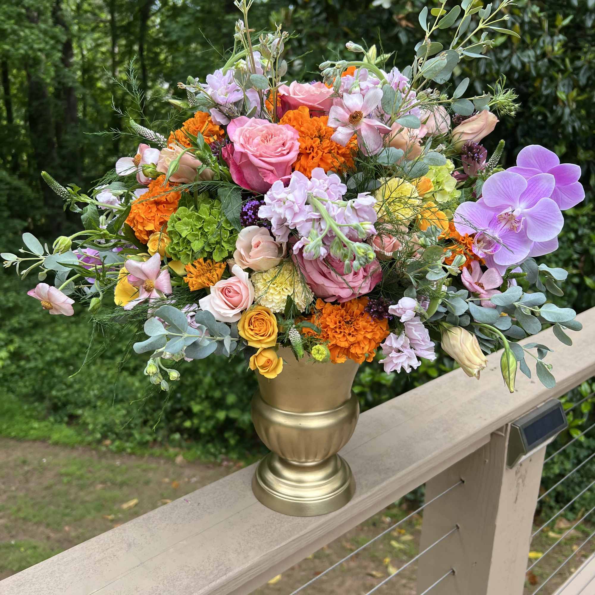 Assortment of high end flowers with orchid accents. Color palette options are