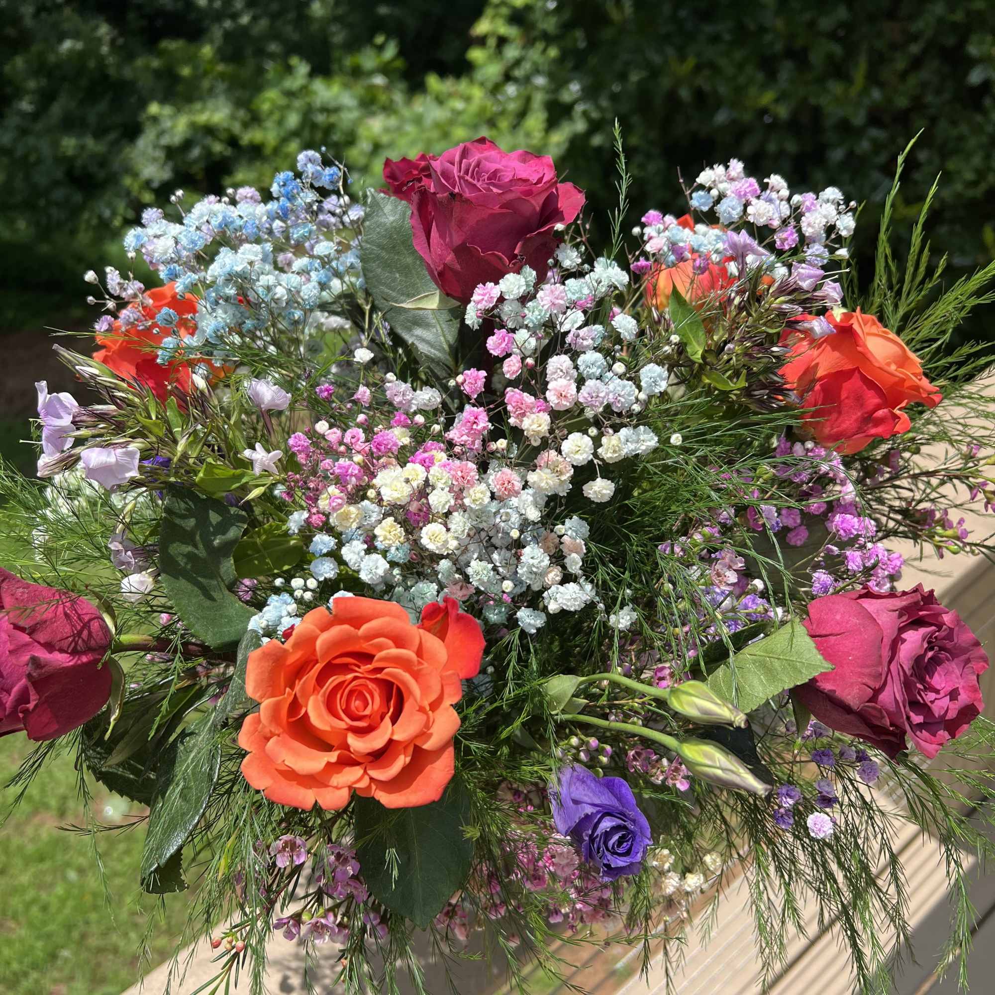 Vibrant arrangement with a color palette of orange yellow green blue. Full