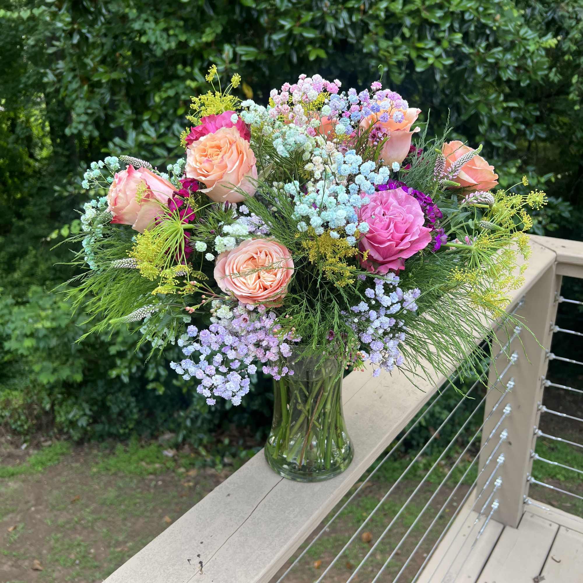 Vibrant arrangement with a color palette of orange yellow green blue. Full