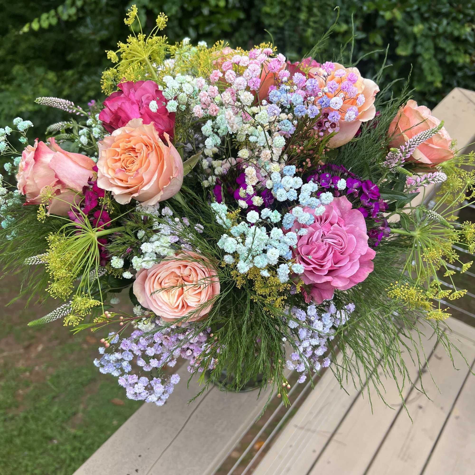Vibrant arrangement with a color palette of orange yellow green blue. Full