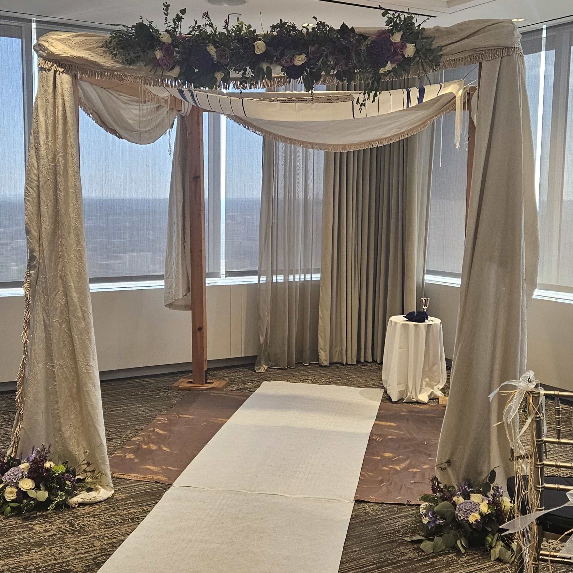 florals and greens woven around said structure