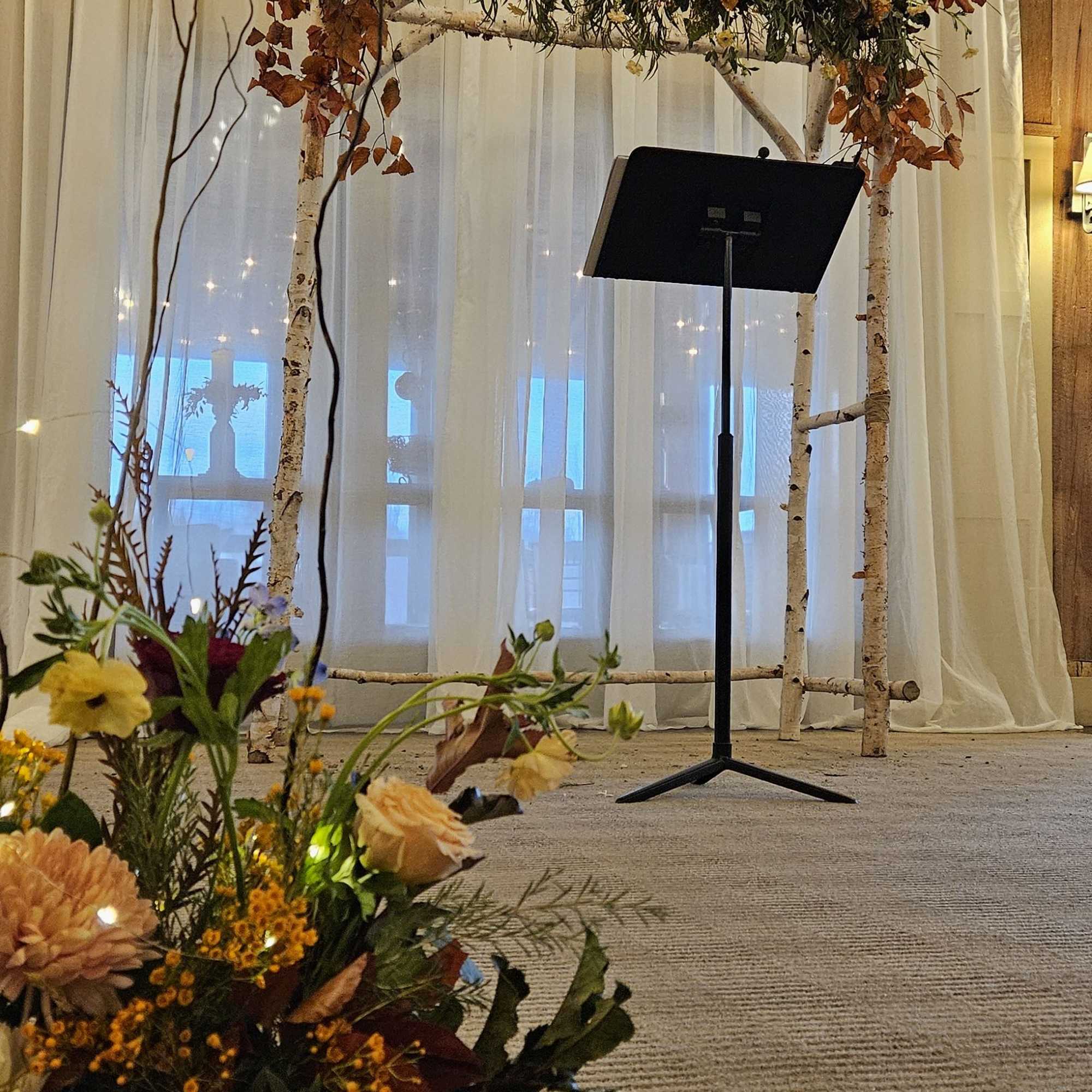 florals and greens woven around said structure