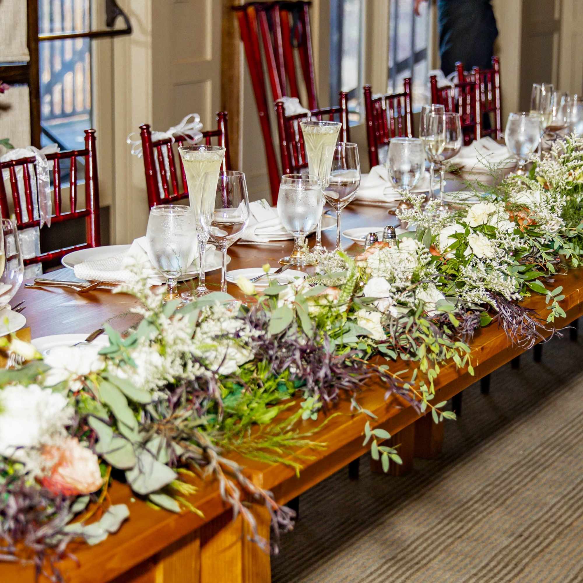 florals and greens woven around said structure