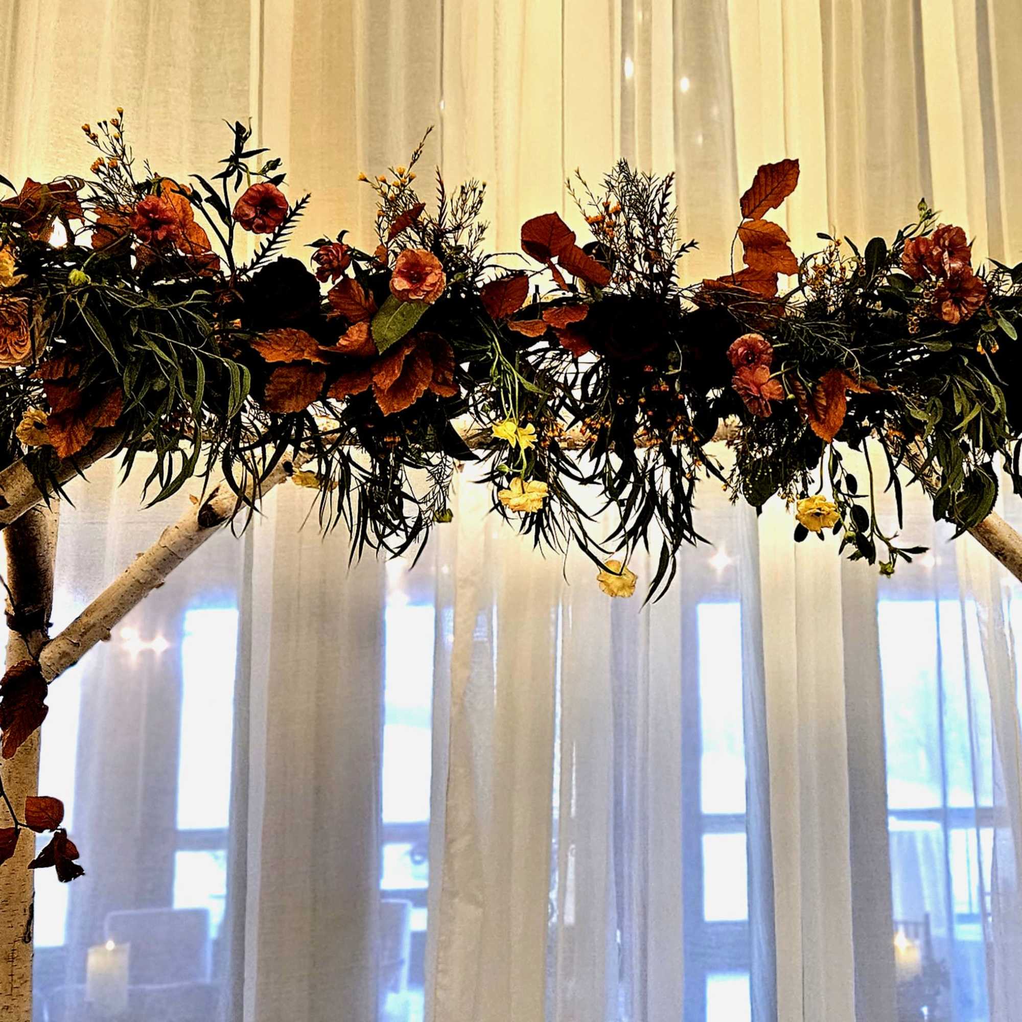 florals and greens woven around said structure