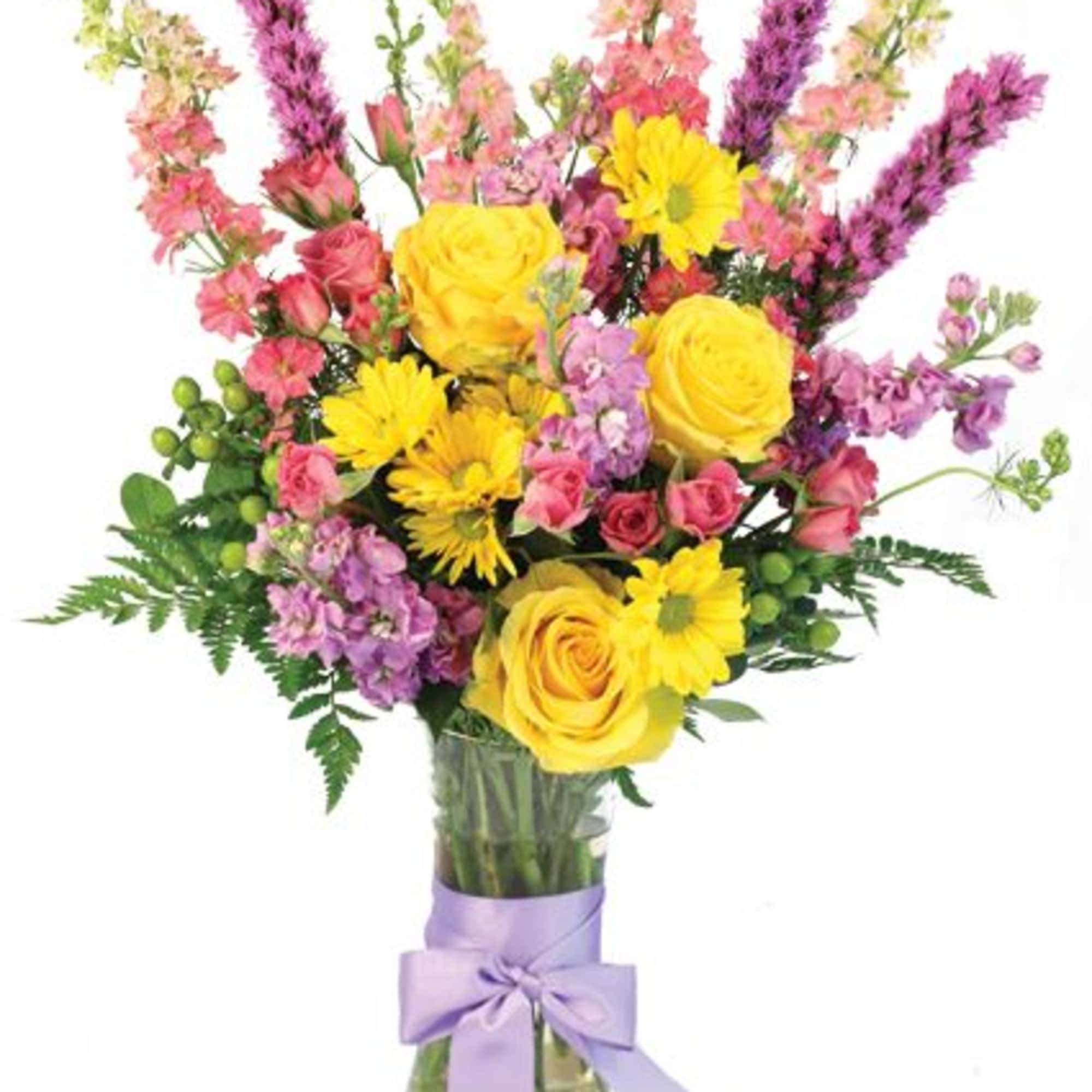 Pastels have never looked so fetching! The flawless yellow daisies and roses