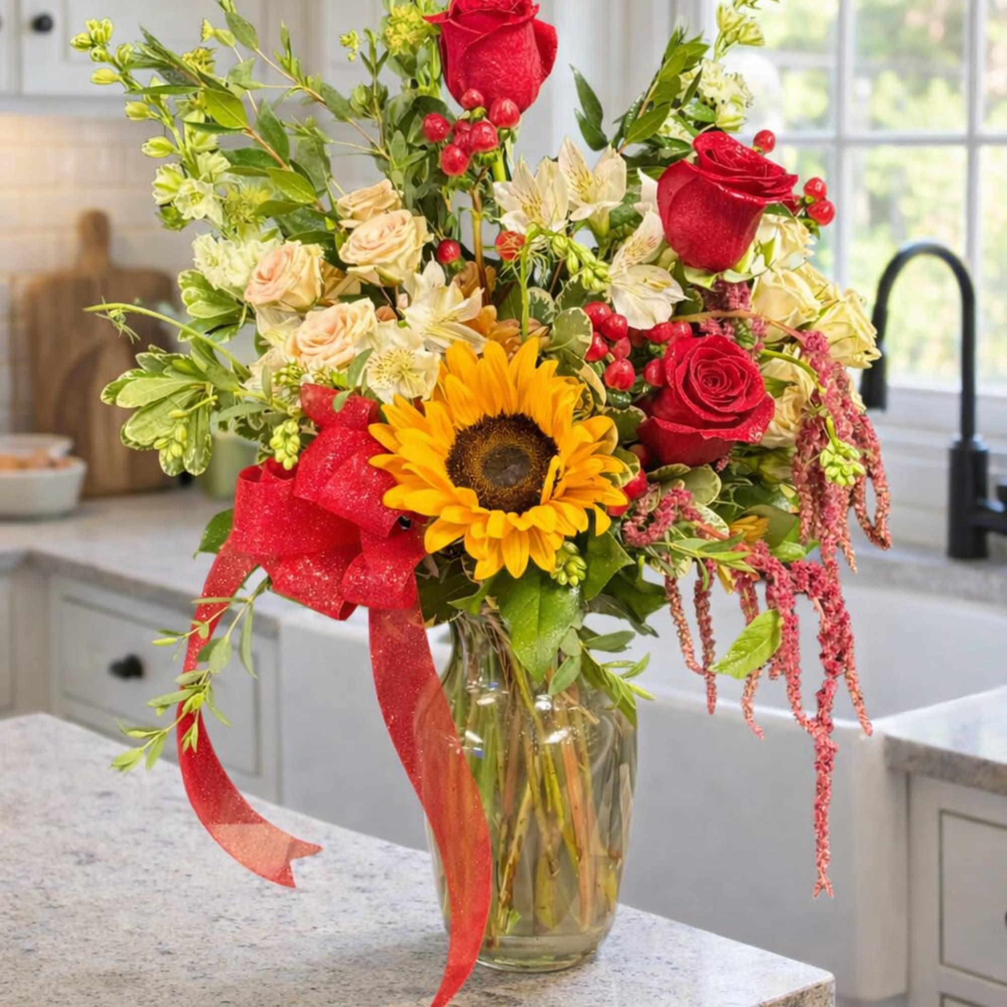 A cheerful, abundant bouquet that puts a sunny sunflower center stage -