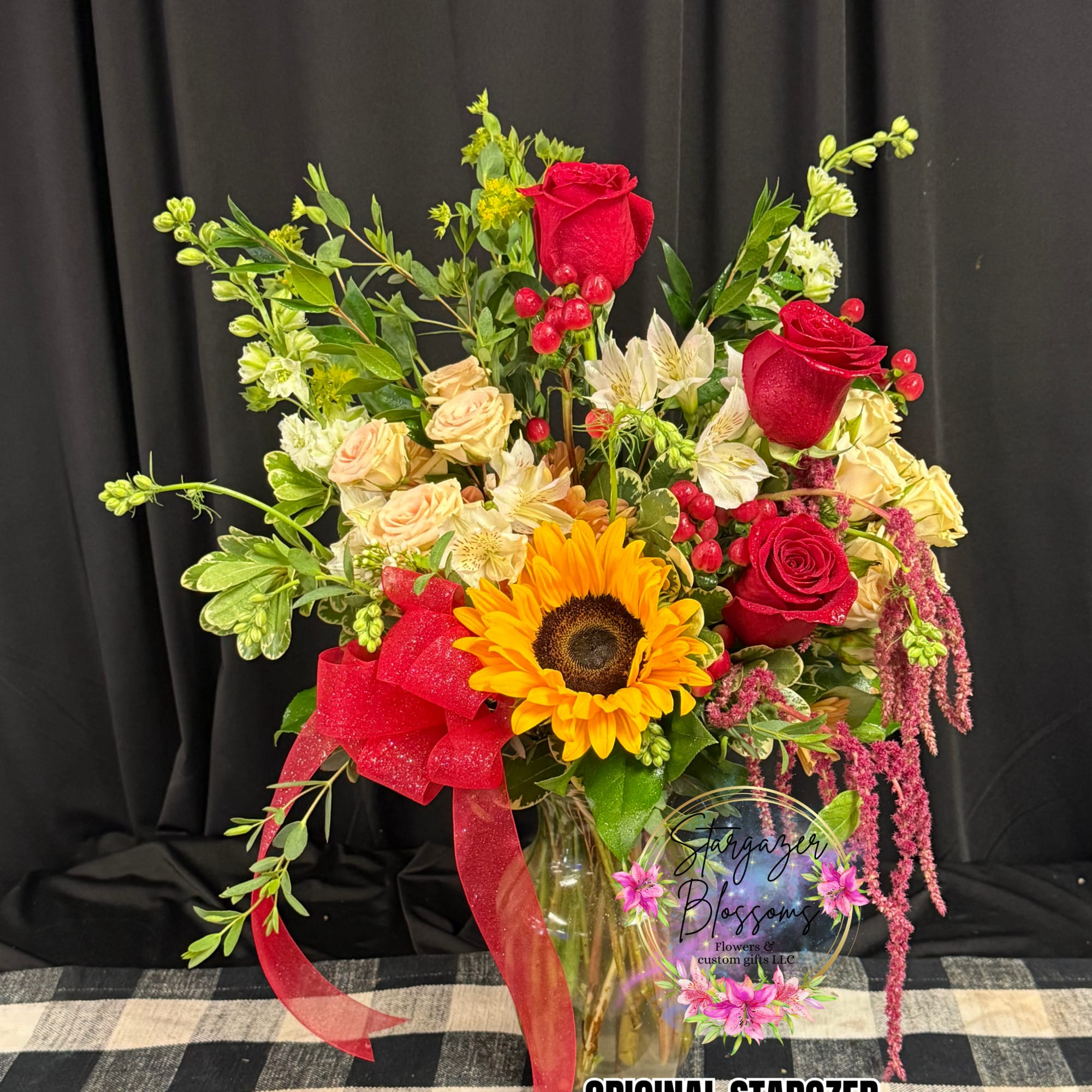 A cheerful, abundant bouquet that puts a sunny sunflower center stage -