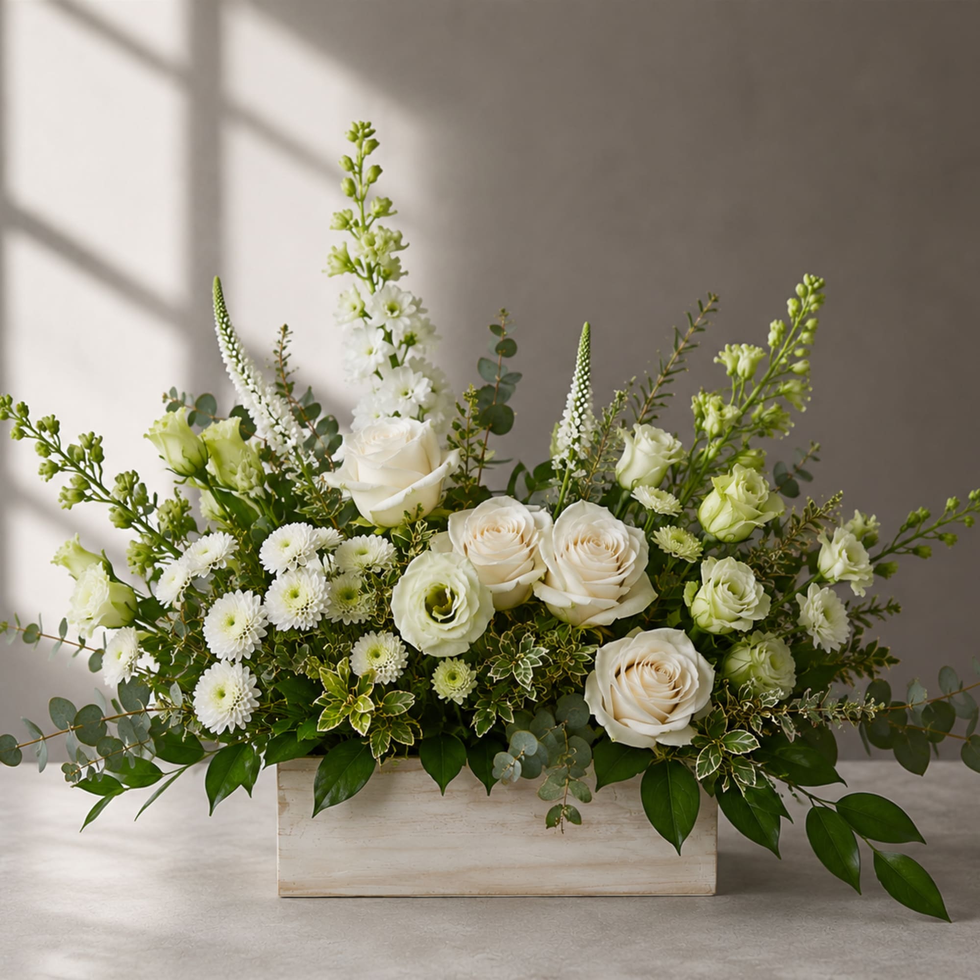Sanctuary is a floral expression of calm. Soft white roses, delicate lisianthus