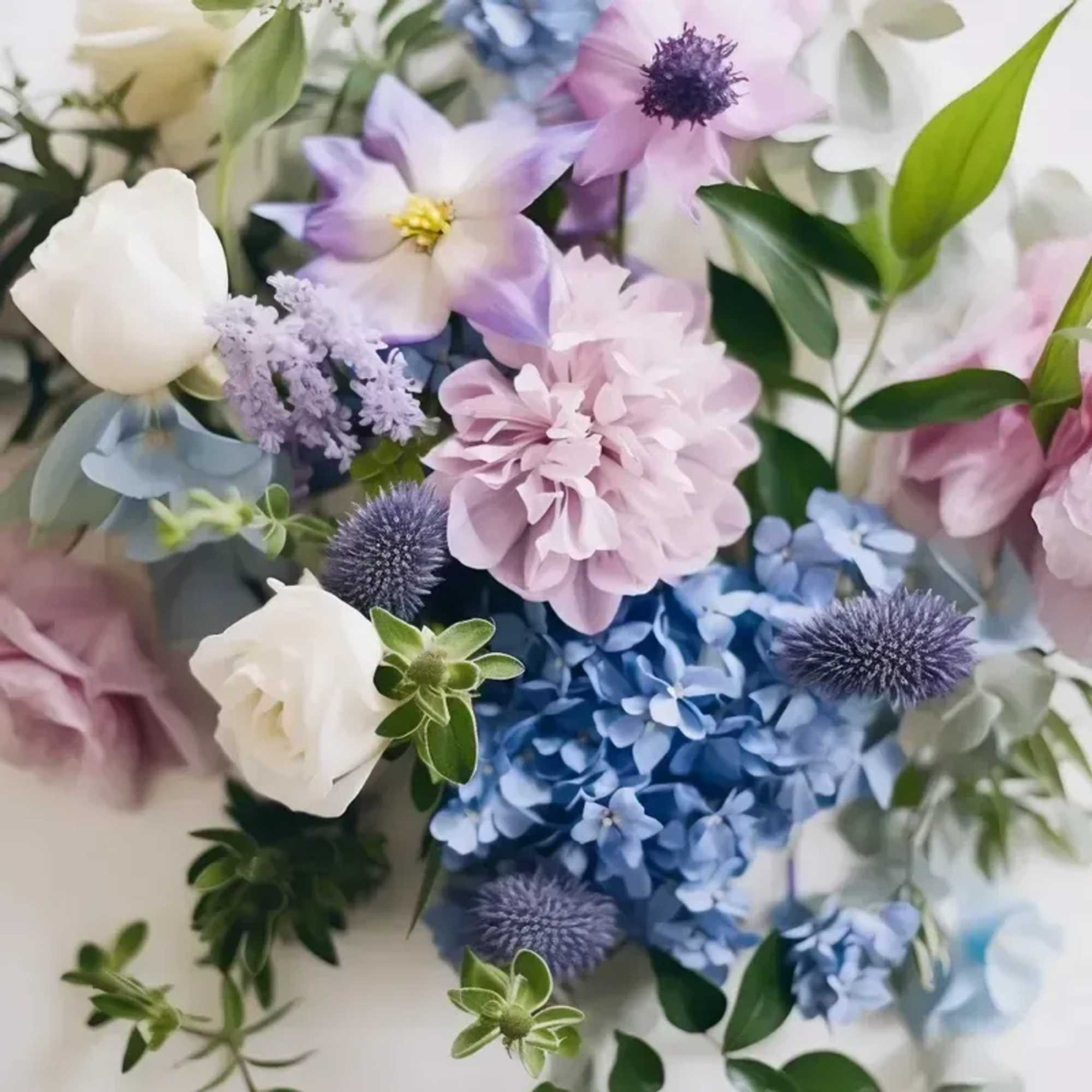 Floral arrangement of seasonal blooms in Cool Tones arranged in a vase.