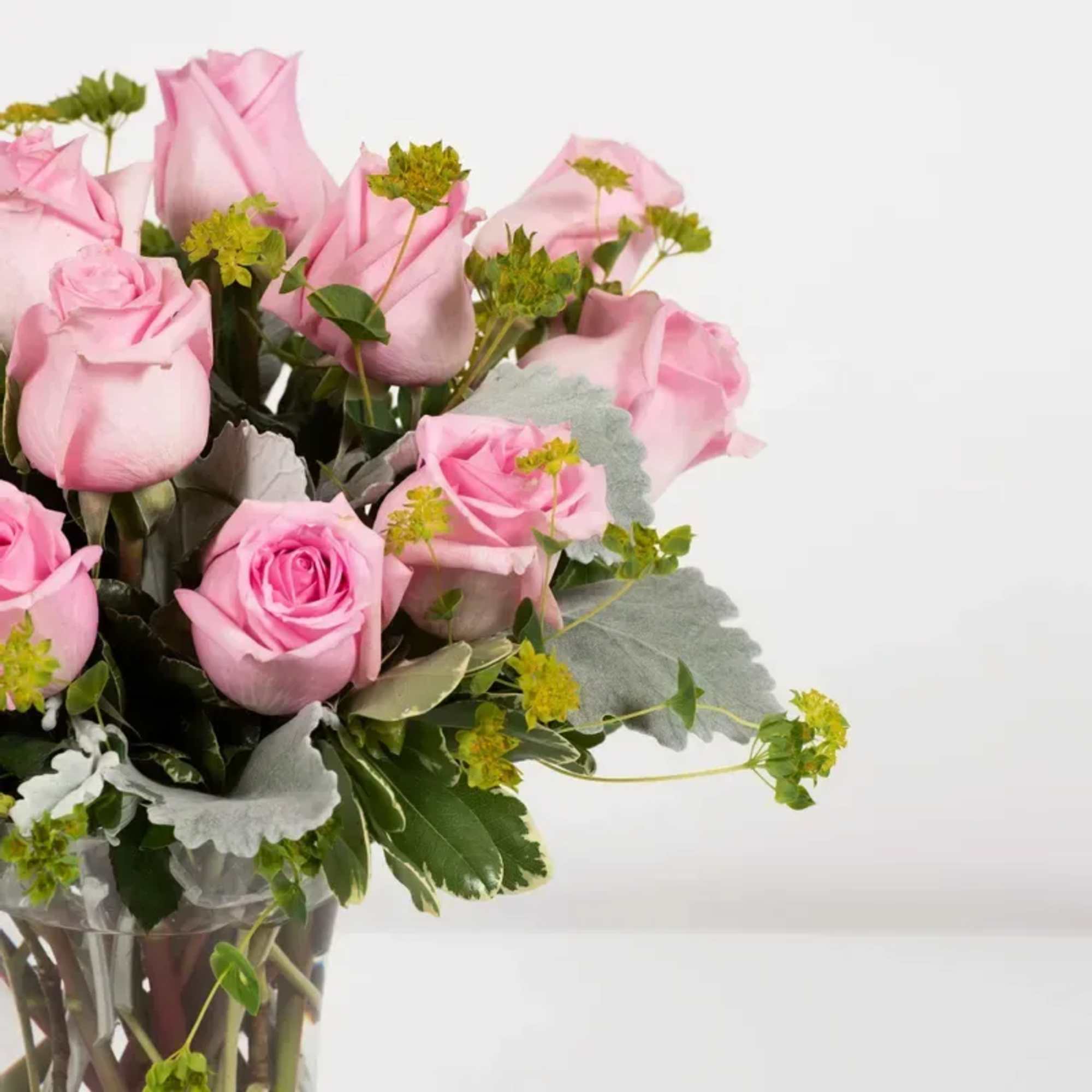 Send your sweetheart a sweet arrangement of a dozen pink roses, signifying