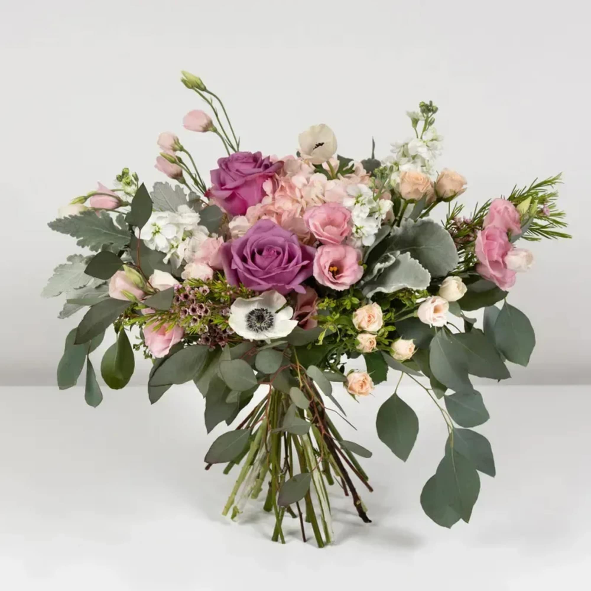 Cool off with this lovely bouquet of roses and hydrangeas.
